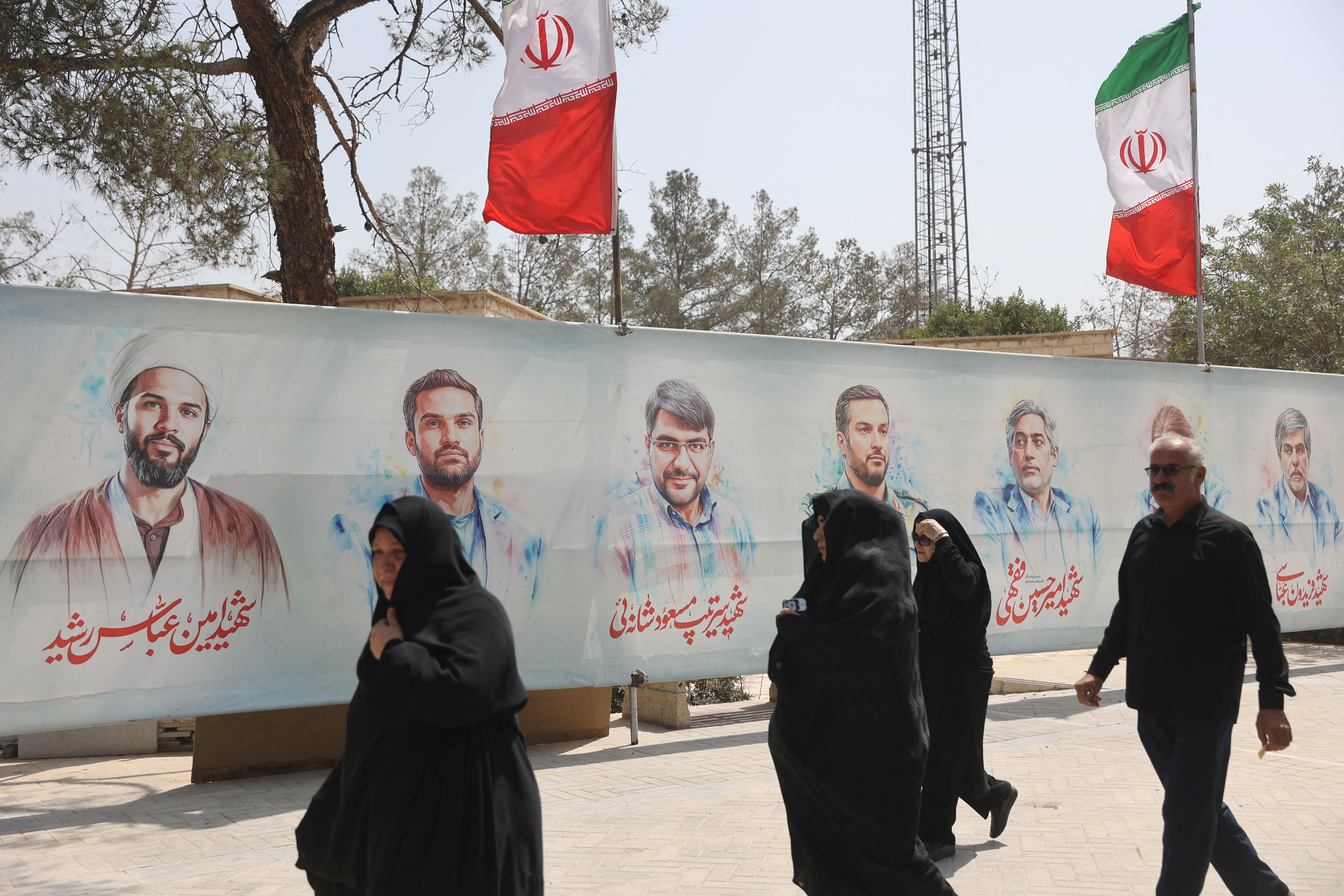 Pictures of Iranian military commanders, nuclear scientists and others killed in Israeli strikes are displayed in Behesht Zahra Cemetery in southern Tehran, Iran, July 11, 2025. Majid Asgaripour/WANA (West Asia News Agency) via REUTERS ATTENTION EDITORS - THIS PICTURE WAS PROVIDED BY A THIRD PARTY