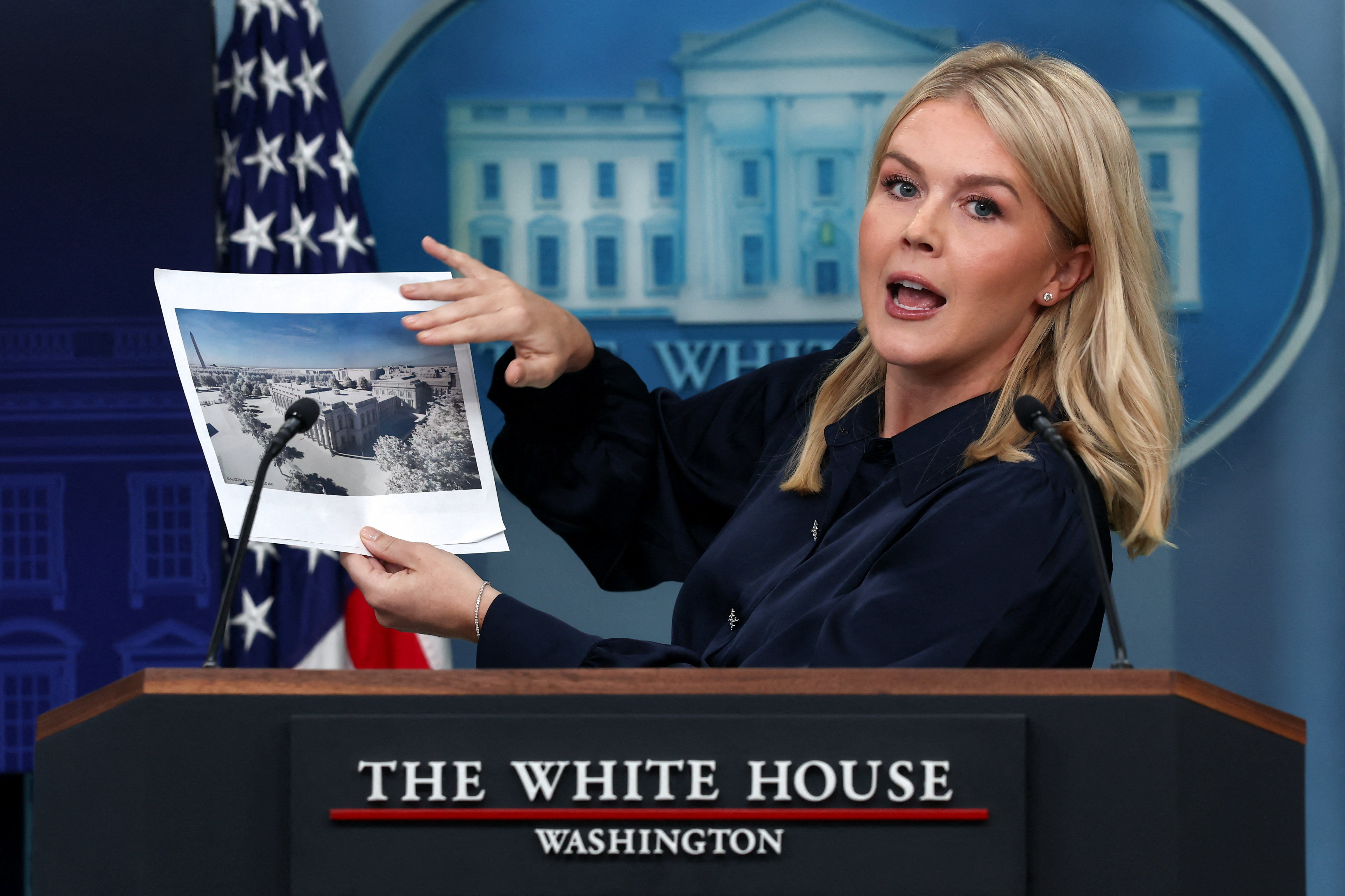 White House Press Secretary Karoline Leavitt holds an image of a rendering of the new White House ballroom to be built, during a press briefing at the White House in Washington, D.C., US, July 31, 2025. [Evelyn Hockstein/Reuters]