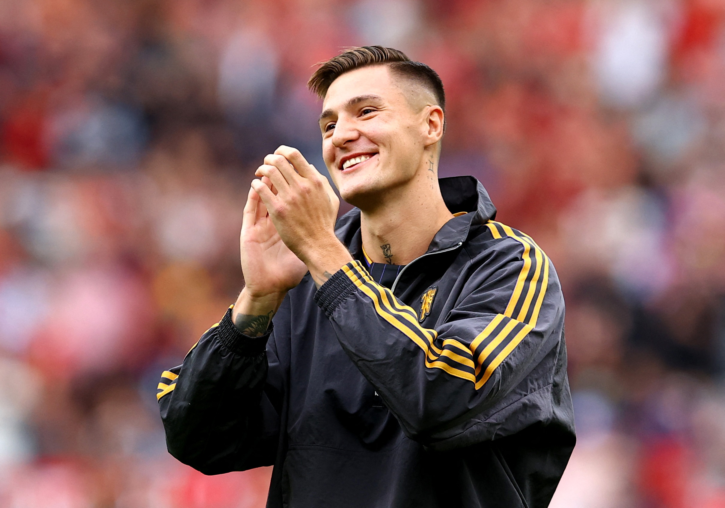 New Manchester United player Benjamin Sesko applauds fans before the pre-season friendly against Fiorentina