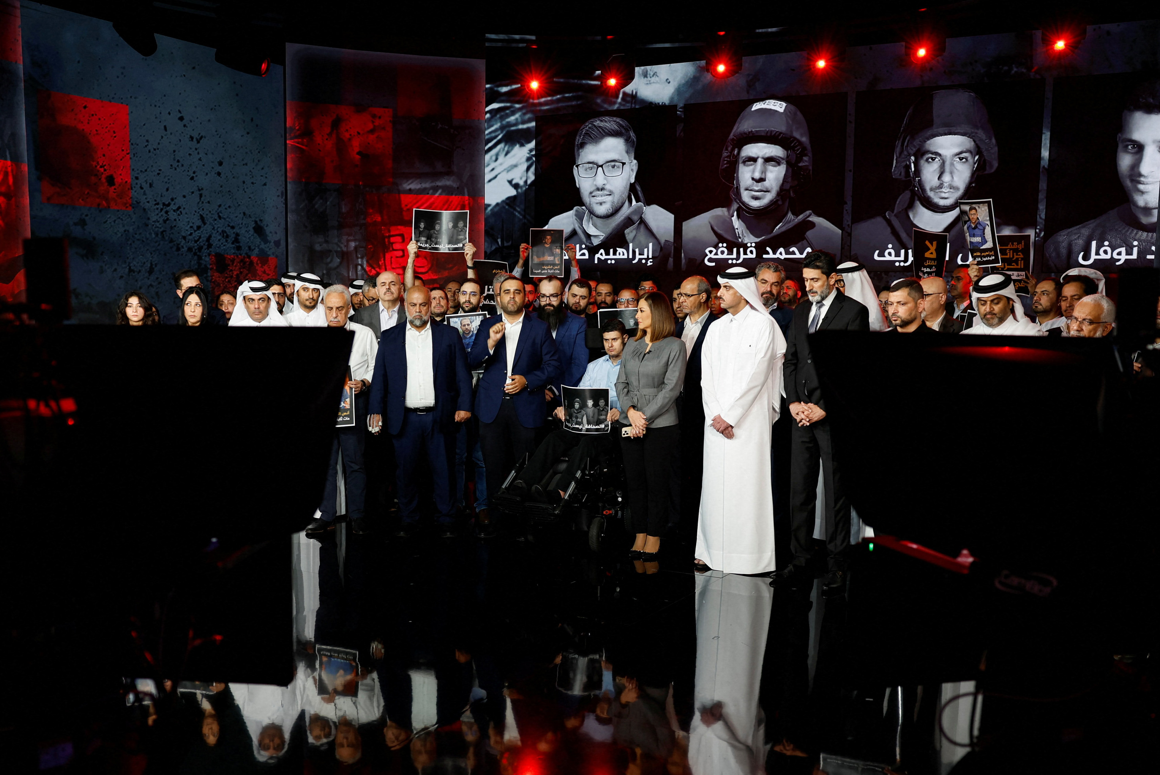 Al Jazeera staff members gather at the network&rsquo;s studios, to remember their colleagues Anas Al Sharif, Mohammed Qreiqeh, Ibrahim Zaher, Mohammed Noufal and another colleague, who were killed in Gaza City by an Israeli strike, in Doha, Qatar, August 11, 2025. [Ibraheem Abu Mustafa/Reuters] (Reuters)