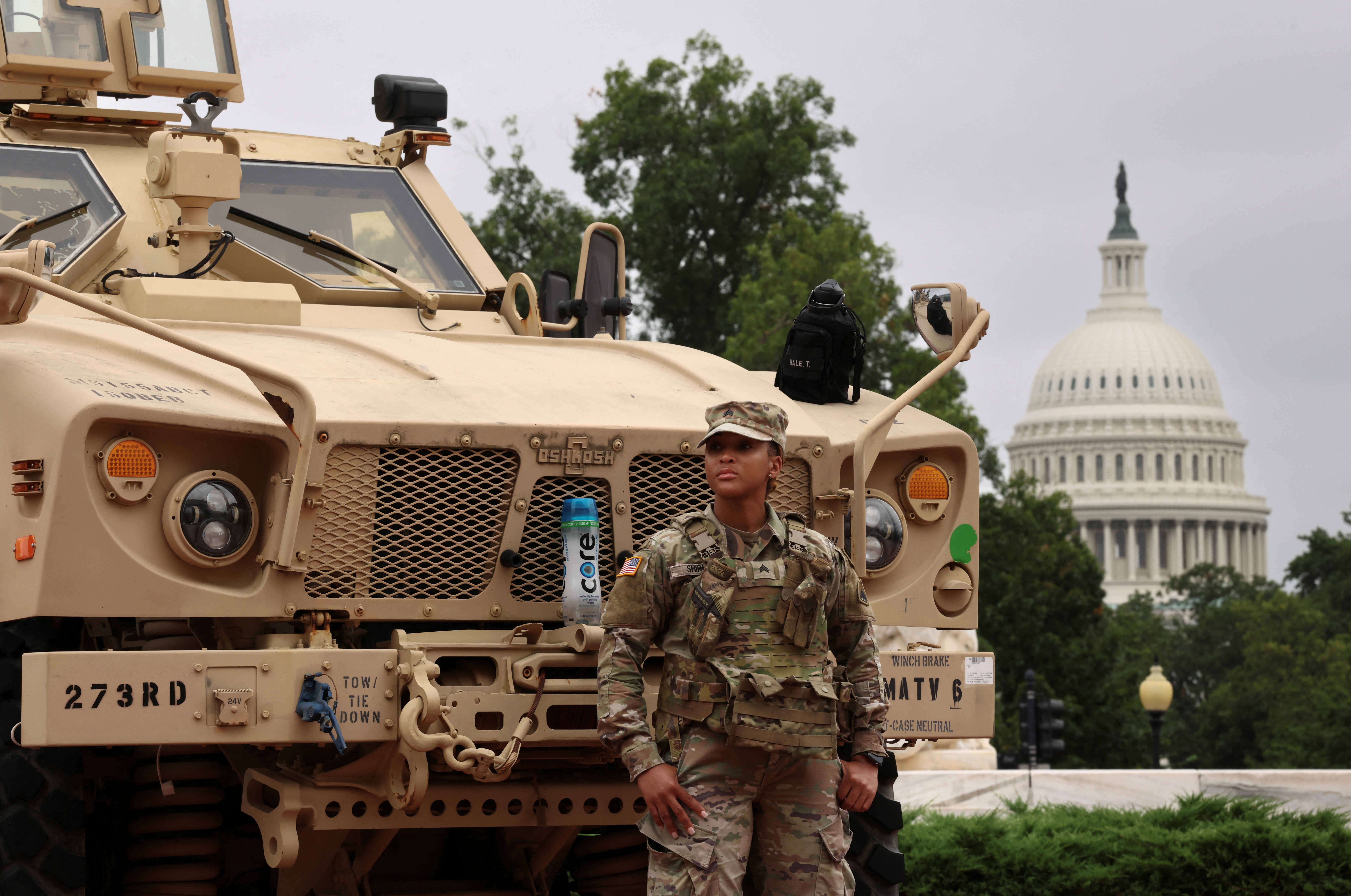 With the dome of the US Capitol in the background, a member of the DC National Guard keep watch outside Union Station on August 19, 2025. [Kevin Lamarque/Reuters]
