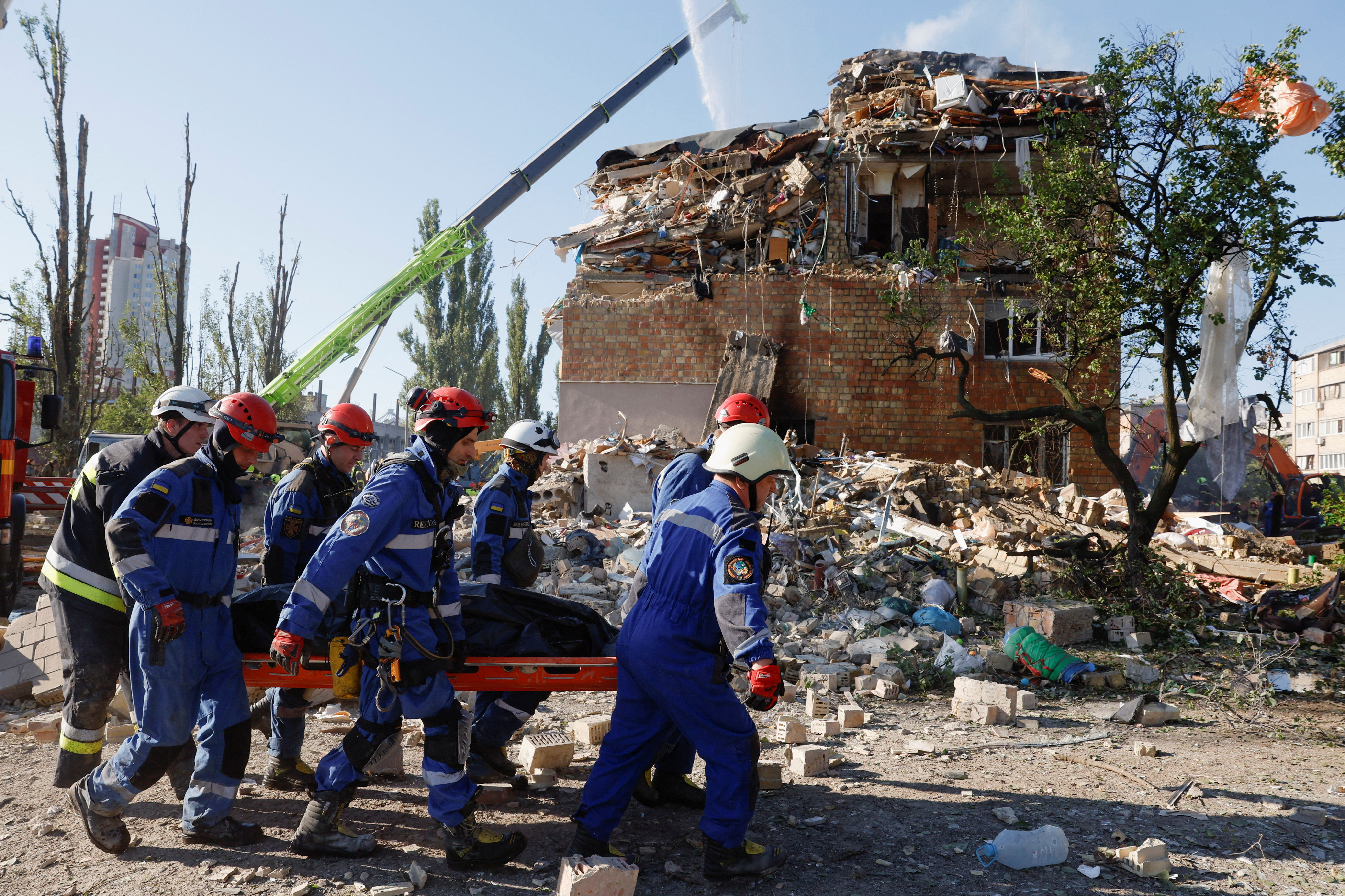 Rescuers carry a casualty in Kyiv