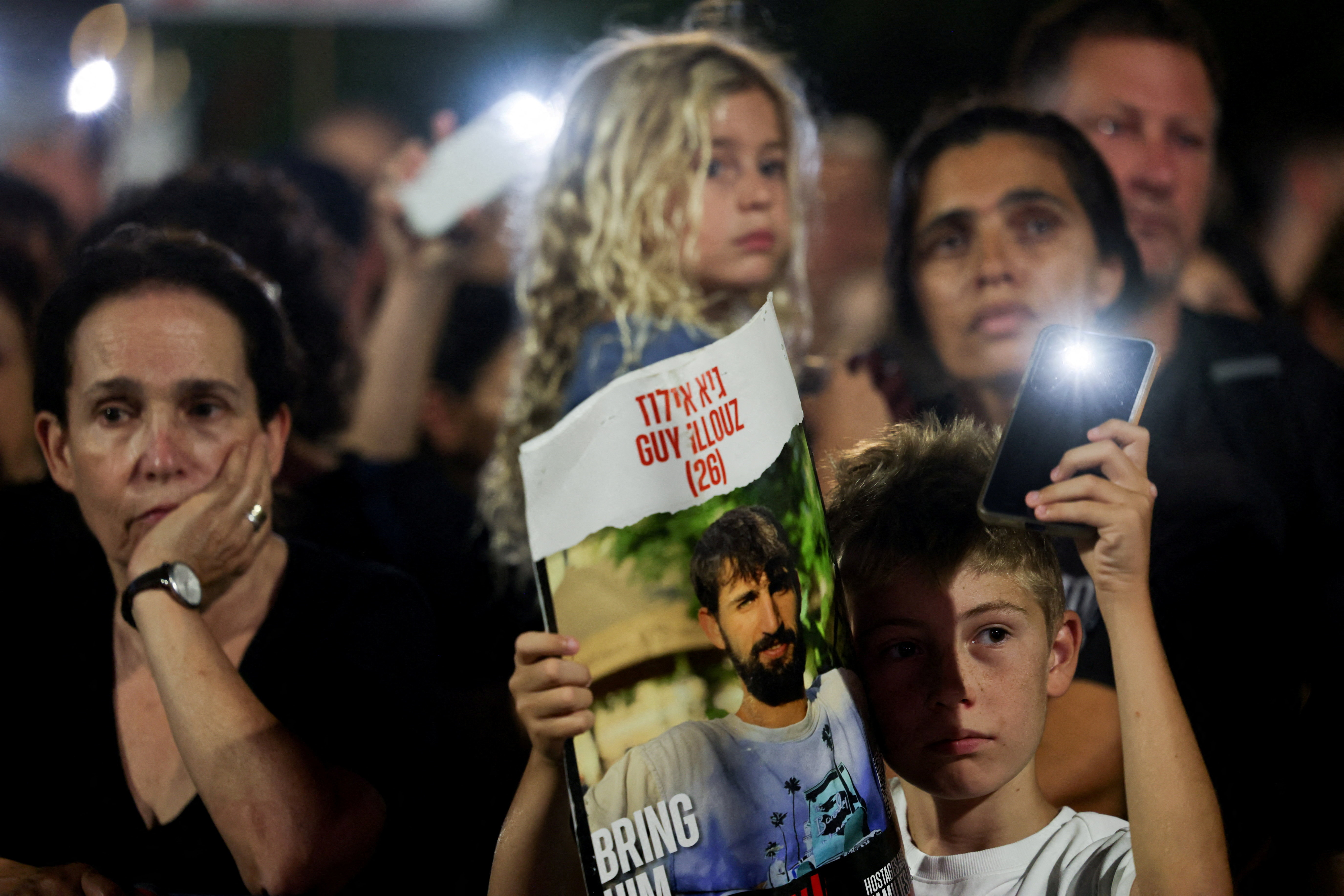 People take part in a rally demanding the immediate release of the captives taken during the deadly October 7, 2023 attack on Israel
