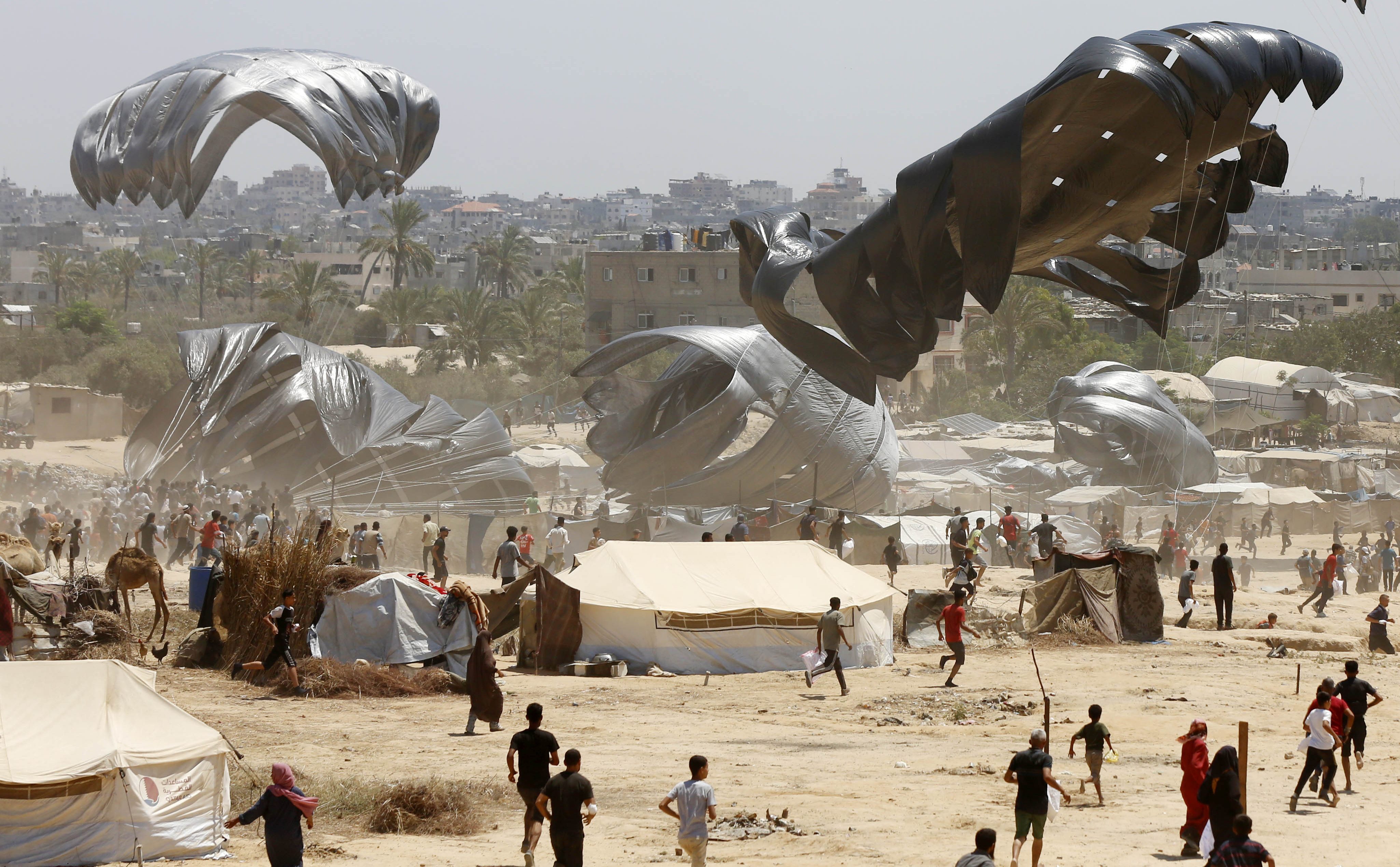 Humanitarian aid parachutes were dropped into Gaza, which is under Israeli attacks and embargo