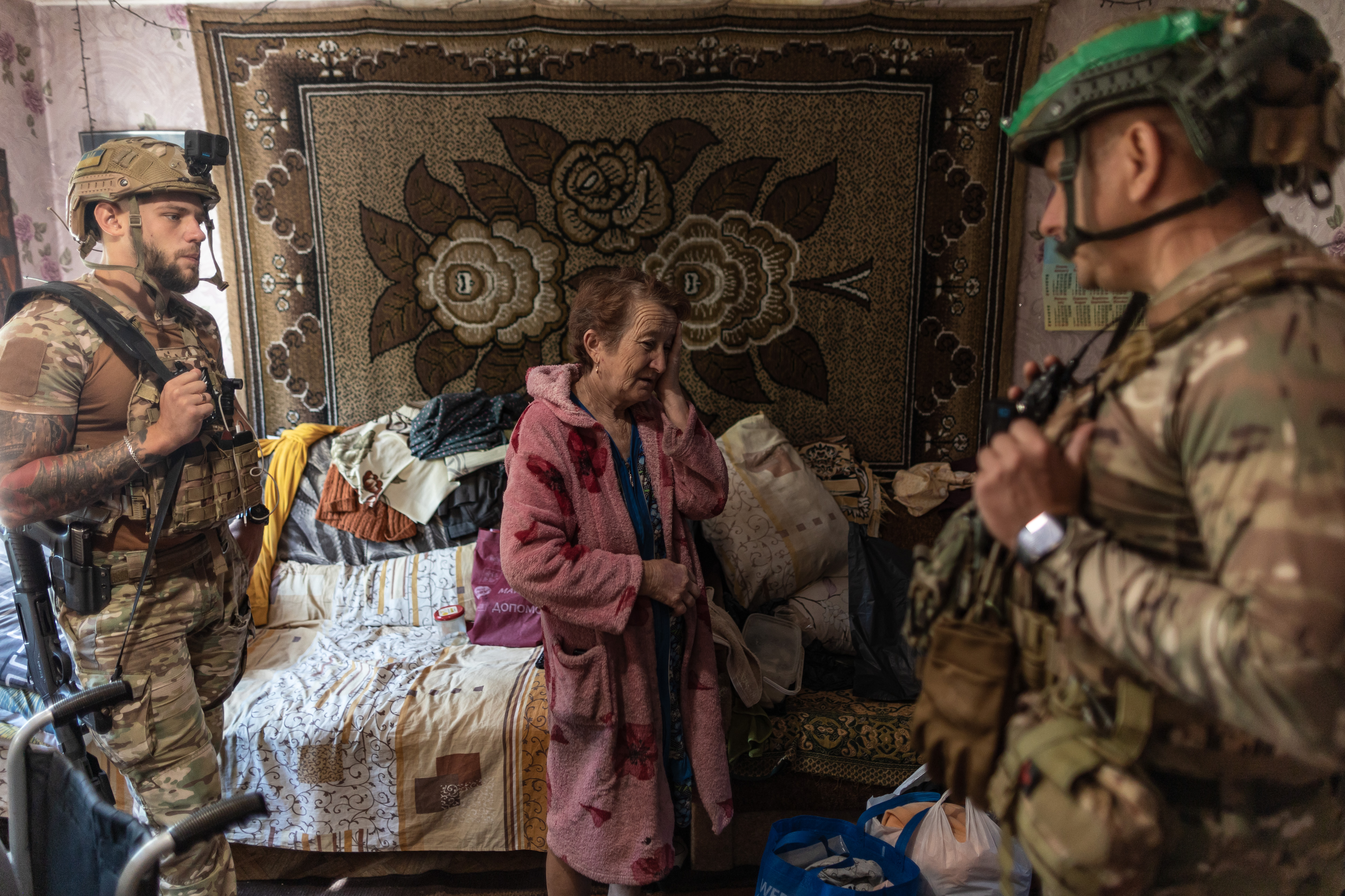ANDRIVKA, UKRAINE - AUG 13: The ‘White Angels’ police group evacuates a couple from the village of Andriivka, following the advance of Russian troops, in the Donetsk Oblast, Ukraine, 13 August 2025. ( Diego Herrera Carcedo - Anadolu Agency )