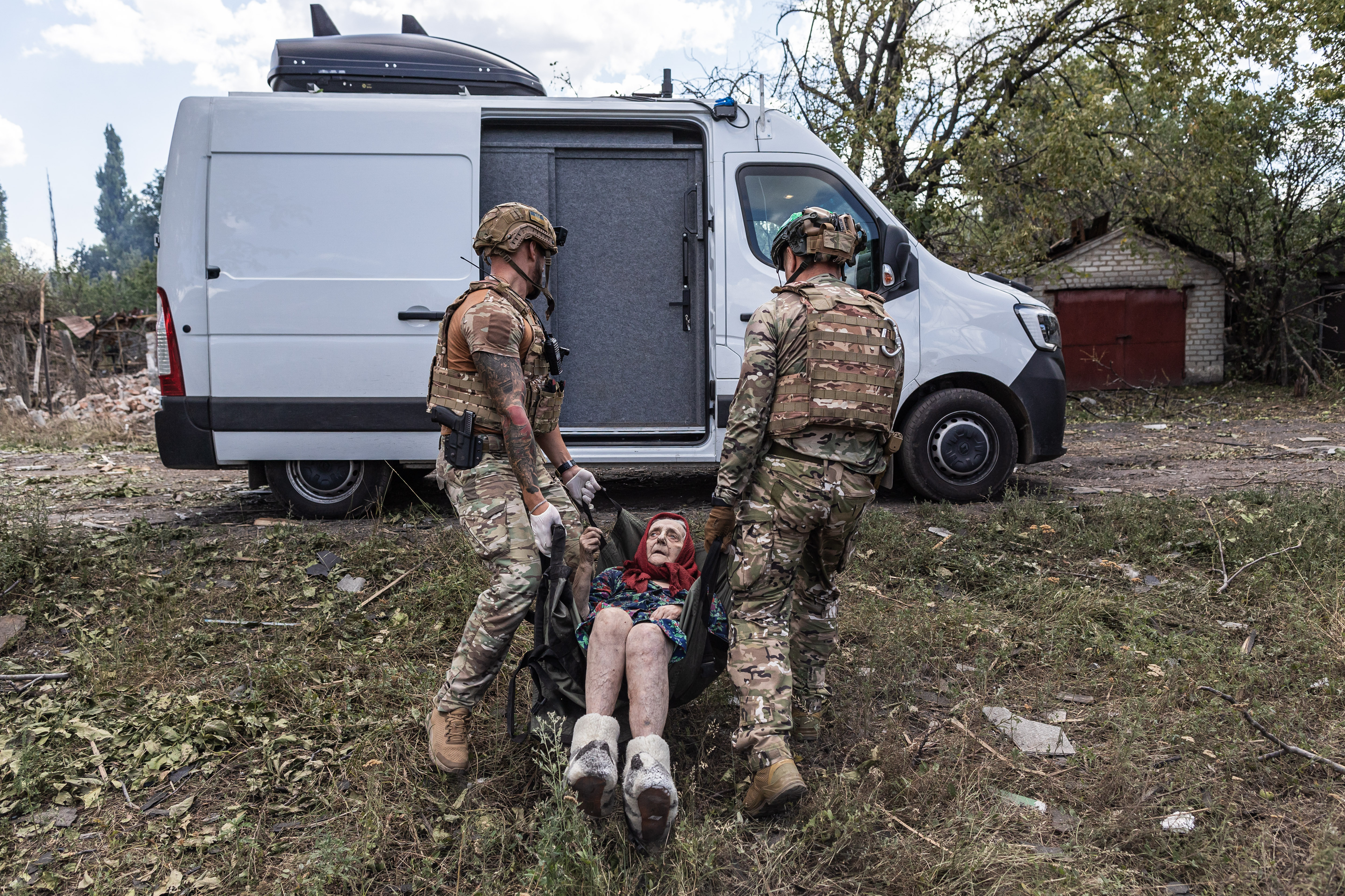BILYTSKE, UKRAINE - AUG 13: The ‘White Angels’ police group evacuates civilians from the village of Bilytske, following the advance of Russian troops, in the Donetsk Oblast, Ukraine, 13 August 2025. ( Diego Herrera Carcedo - Anadolu Agency )