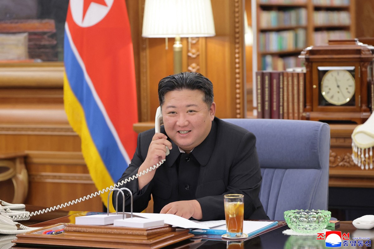 North Korean leader Kim Jong Un holding a telephone conversation with Russian President Vladimir Putin at an undisclosed location in North Korea. [Photo by KCNA VIA KNS/AFP]