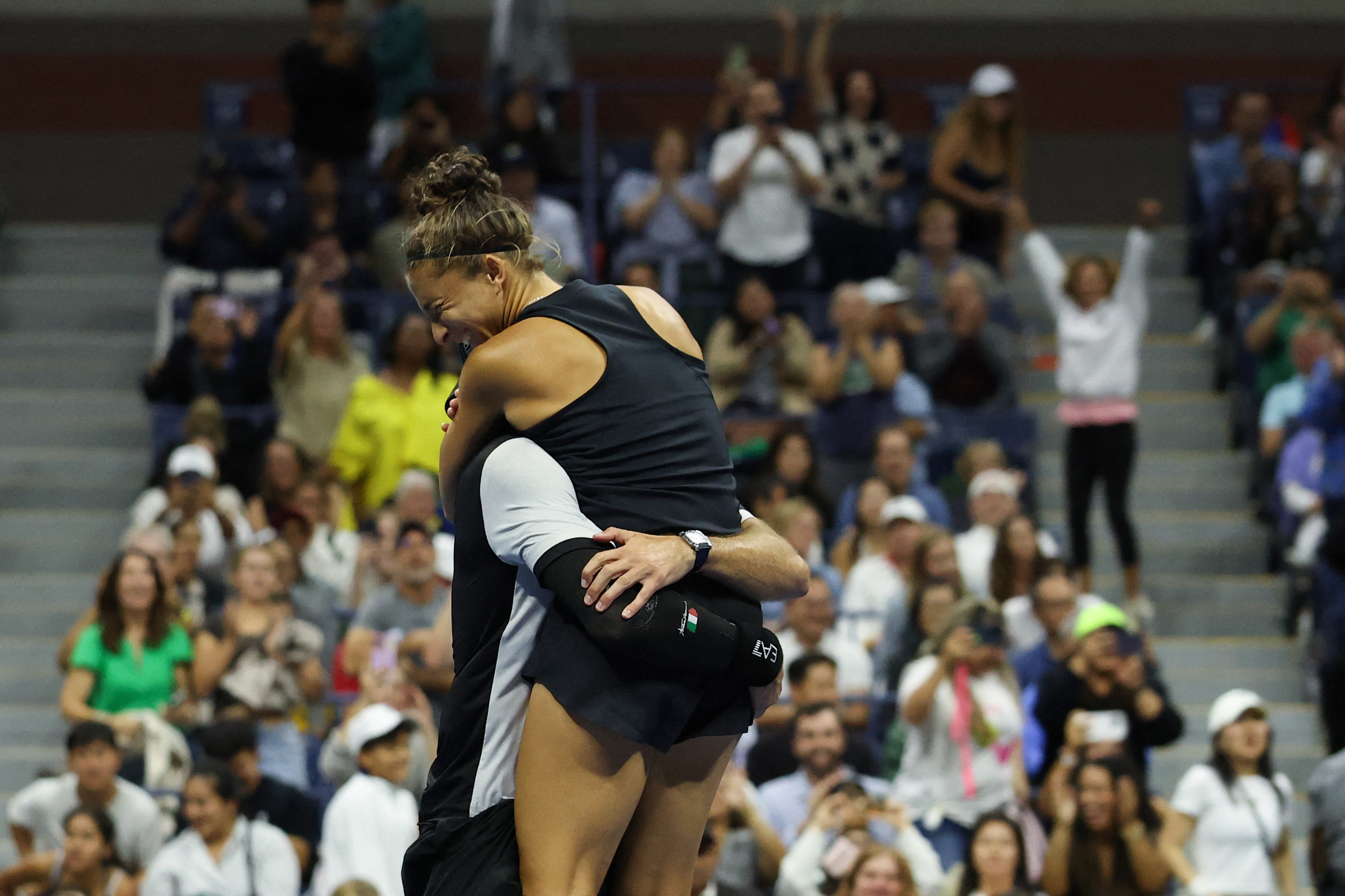 Italy's Andrea Vavassori (L) and Sara Errani celebrate after winning their mixed doubles final tennis match against Norway's Casper Ruud and Poland's Iga Swiatek at the US Open tennis tournament at the USTA Billie Jean King National Tennis Center in New York City, on August 20, 2025. (Photo by TIMOTHY A.CLARY / AFP)