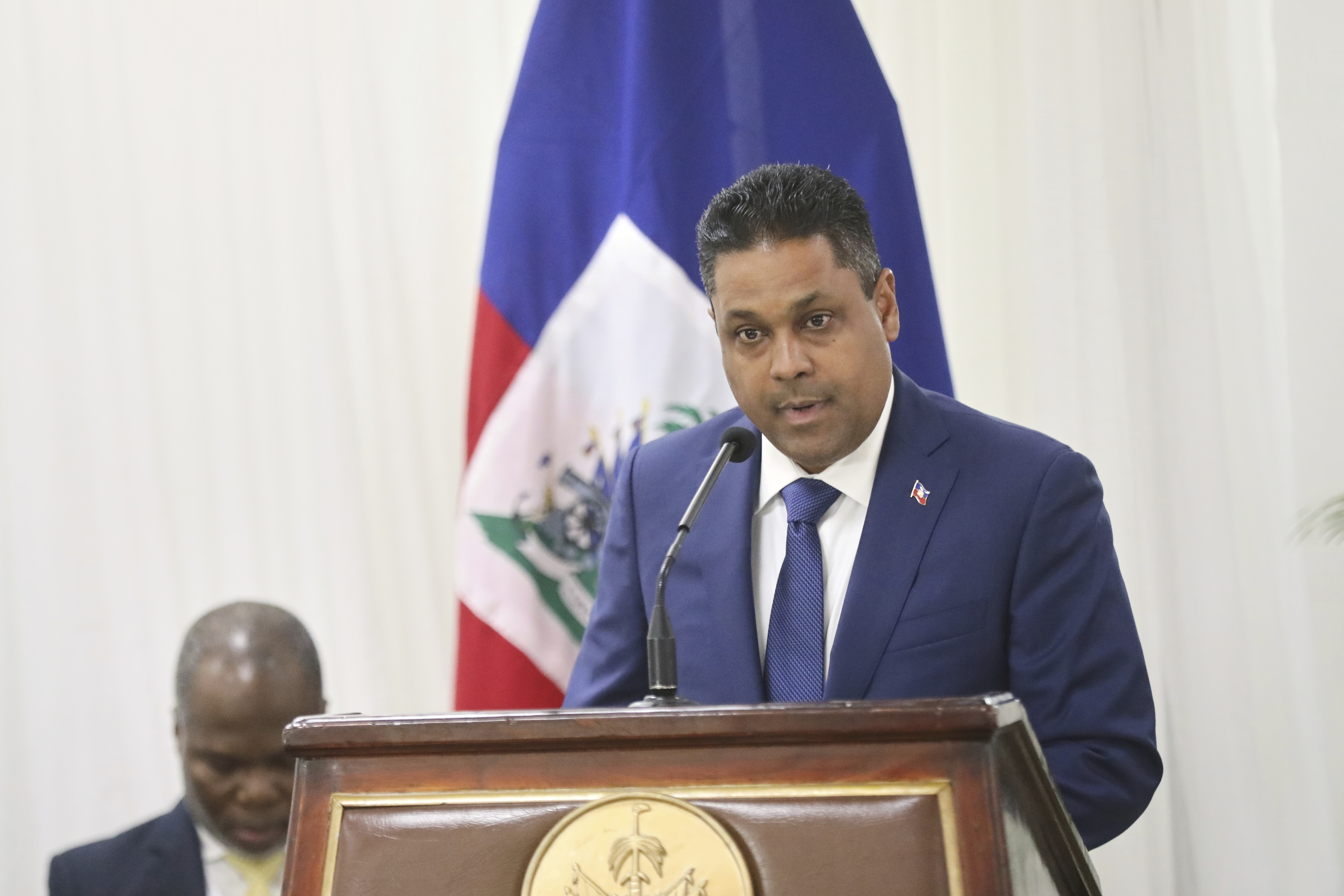 Laurent Saint-Cyr speaks behind a podium at his swearing-in.