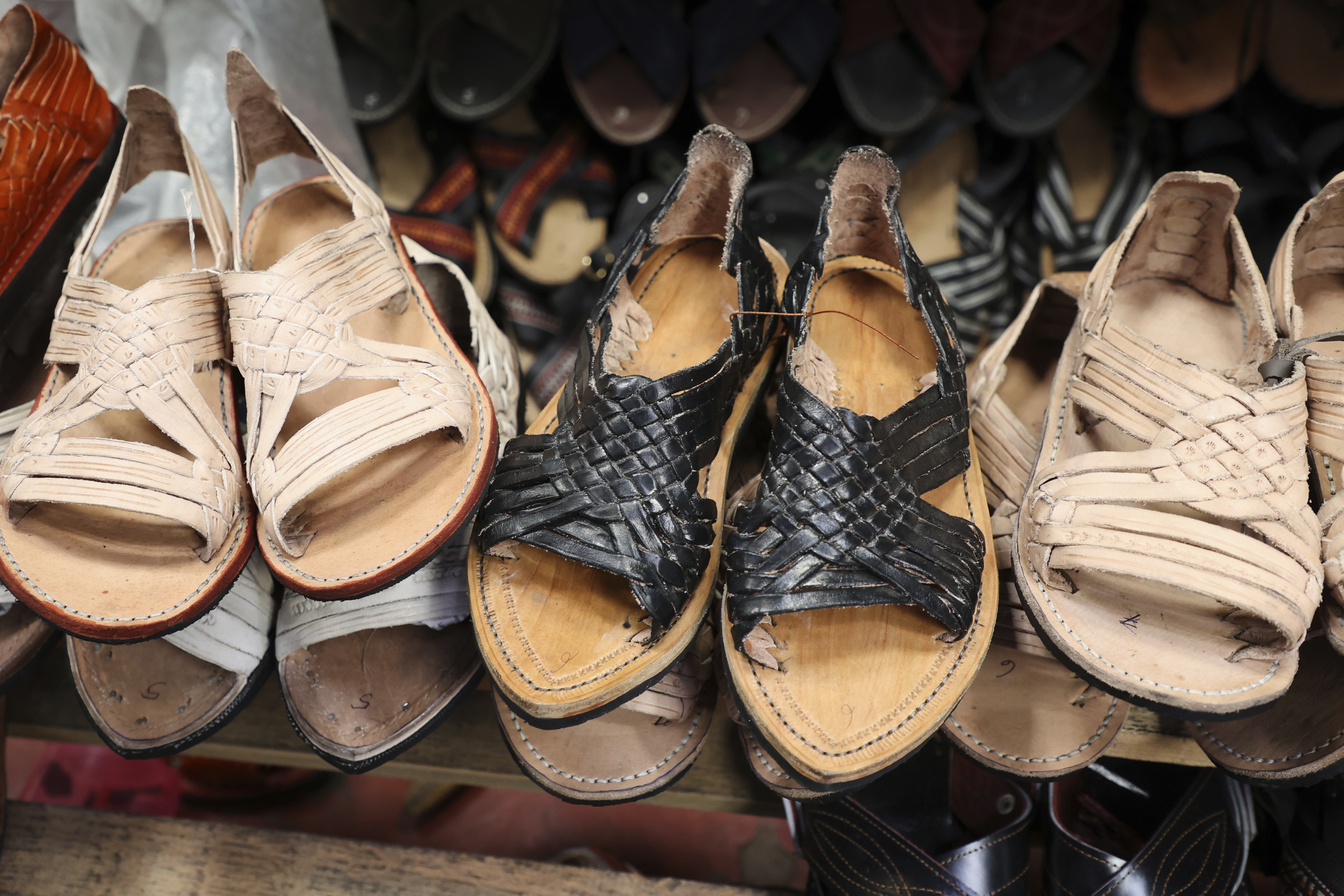 Sandals known as "huaraches" are displayed for sale at a market in Oaxaca, Mexico, Friday, Aug. 8, 2025. (AP Photo/Luis Alberto Cruz)
