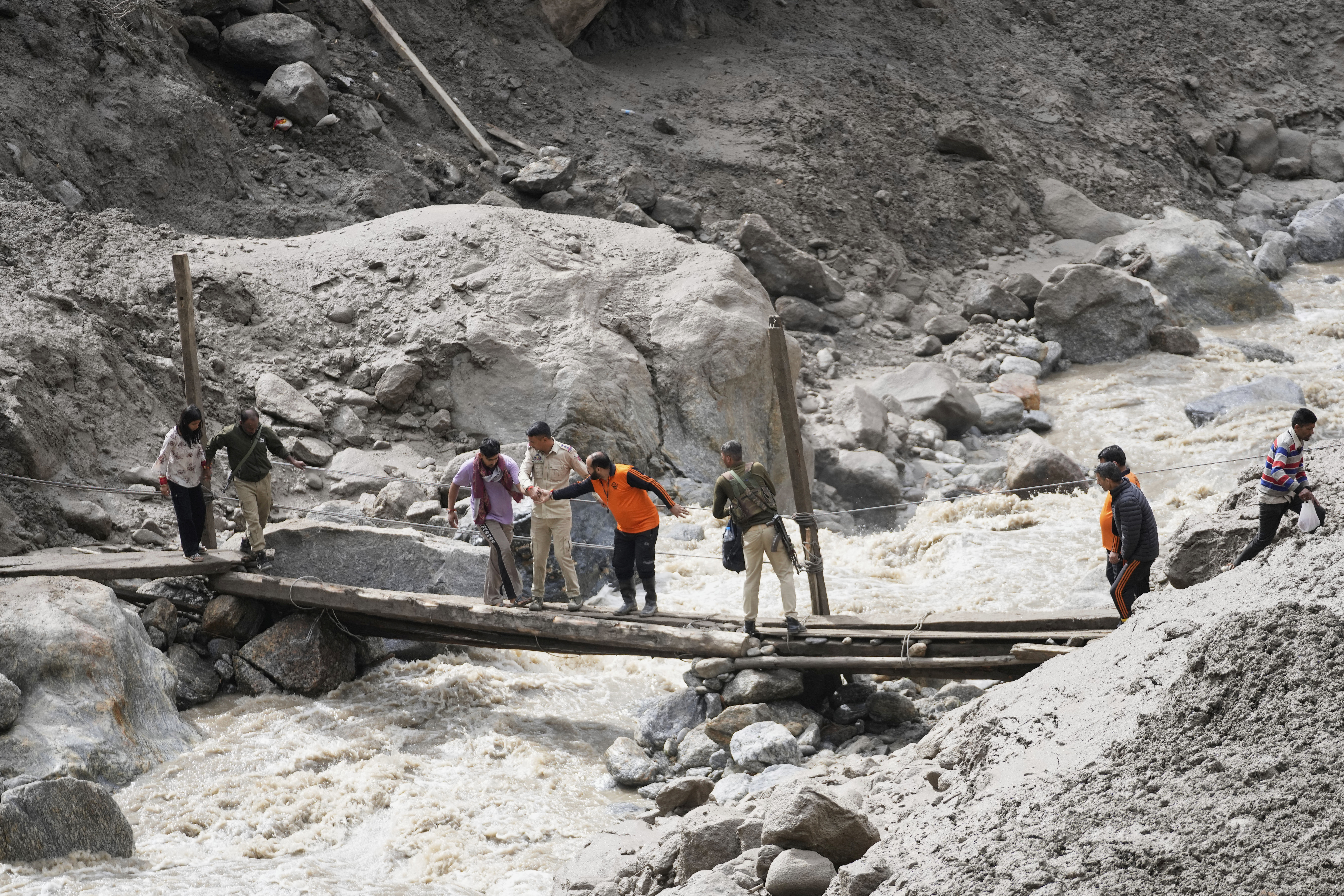 Rescuers search for missing flash flood victims in remote Kashmir village
