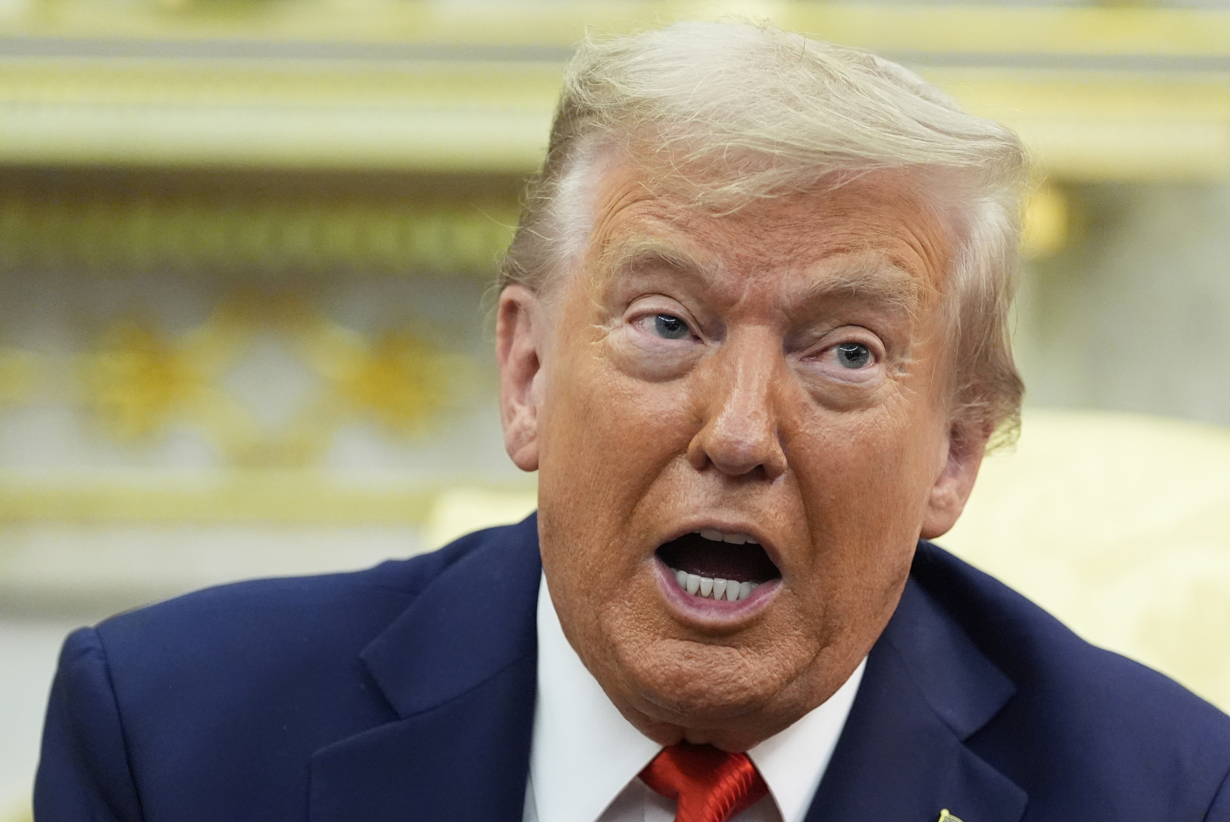 President Donald Trump speaks during a meeting.