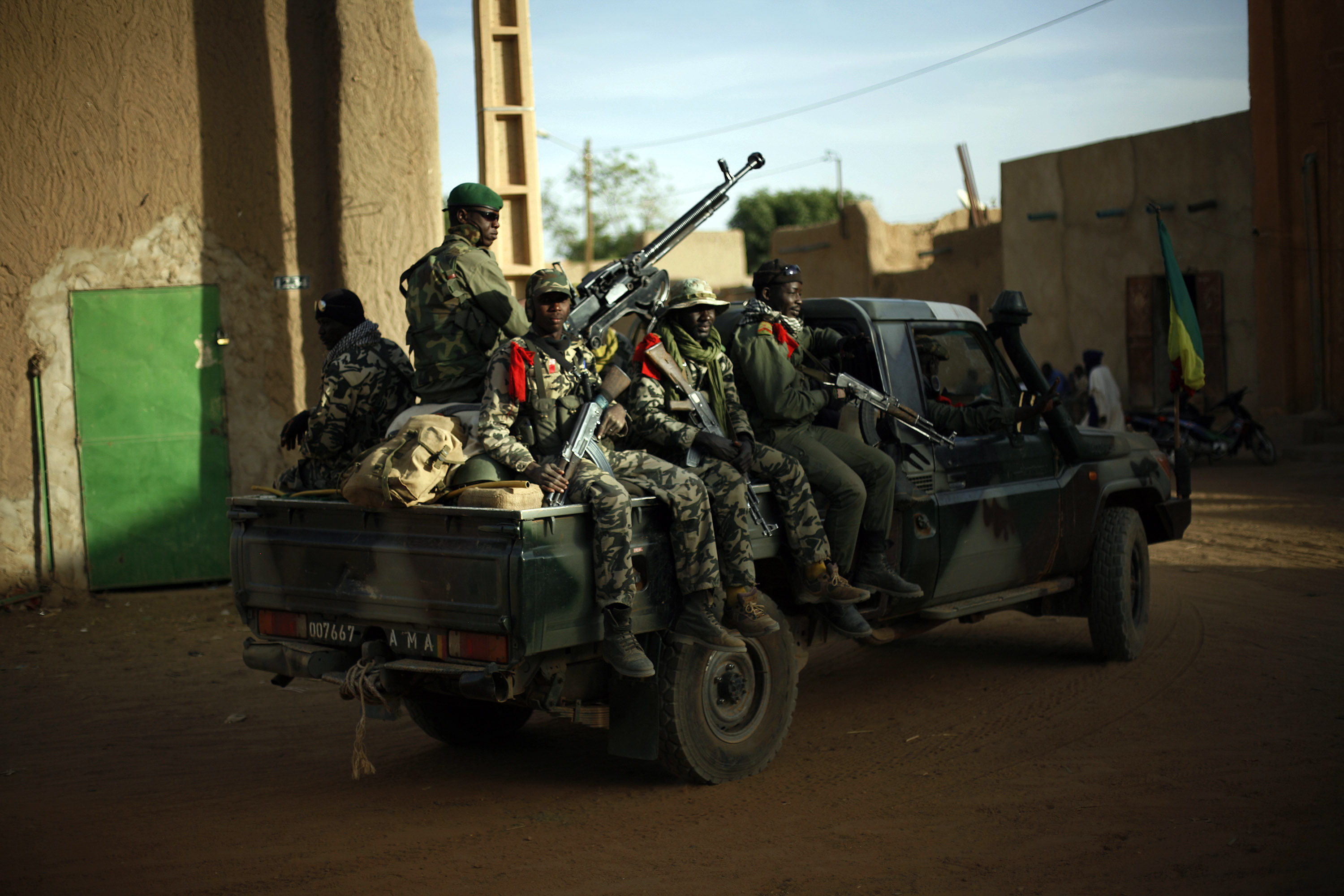Malian soldiers patrol the streets of Gao, northern Mali, Tuesday Feb. 5, 2013. Troops from France and Chad moved into Kidal in an effort to secure the strategic north Malian city, a French official said Tuesday, as the international force put further pressure on the Islamic extremists to push them out of their last major bastion of control in the north.(AP Photo/Jerome Delay)
