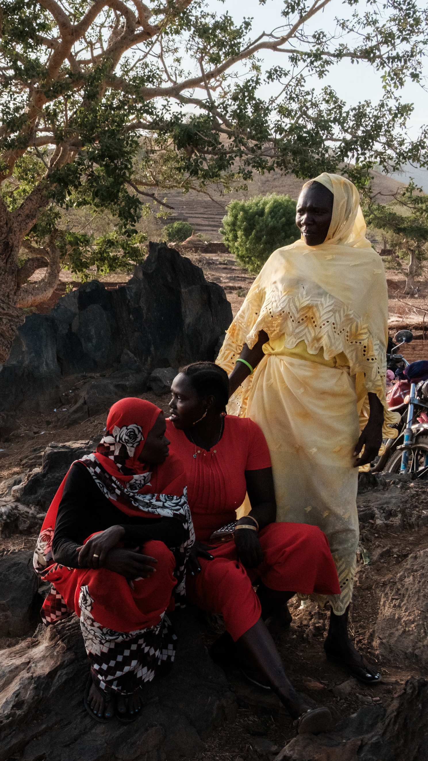 Women watch the giving of the dowry as part of a wedding celebration in Kauda on April 18, 2025. The celebration was going to be delayed as famine stretched peoples' resources until the bride and groom were no longer able to pay for a wedding - so the community came together to raise funds for the dowry [Guy Peterson/Al Jazeera]