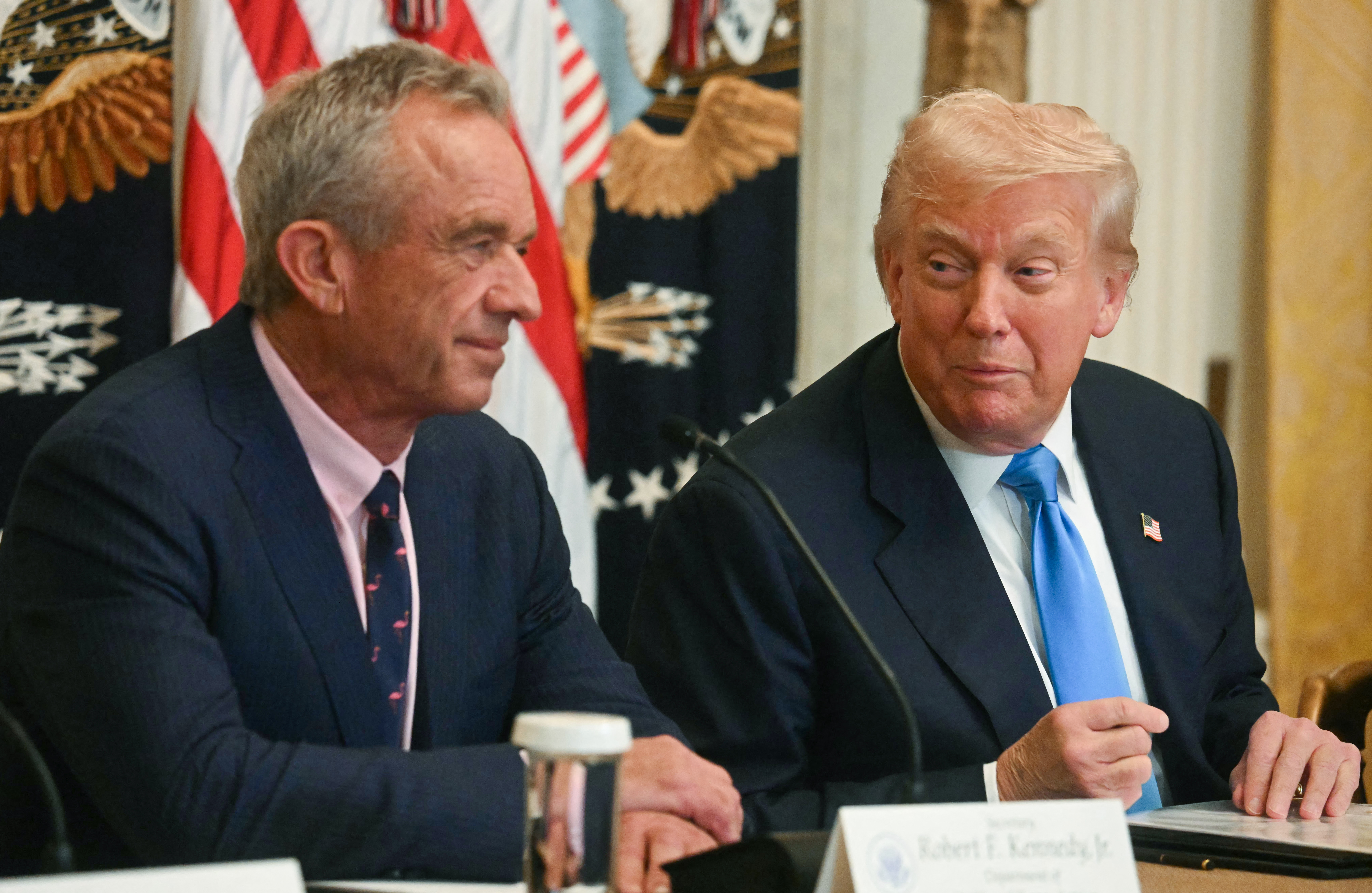 US Secretary of Health and Human Services Robert F. Kennedy Jr. (L) and US President Donald Trump participate in an event on "Making Health Technology Great Again," in the East Room of the White House in Washington, DC on July 30, 2025. (Photo by Jim WATSON / AFP)