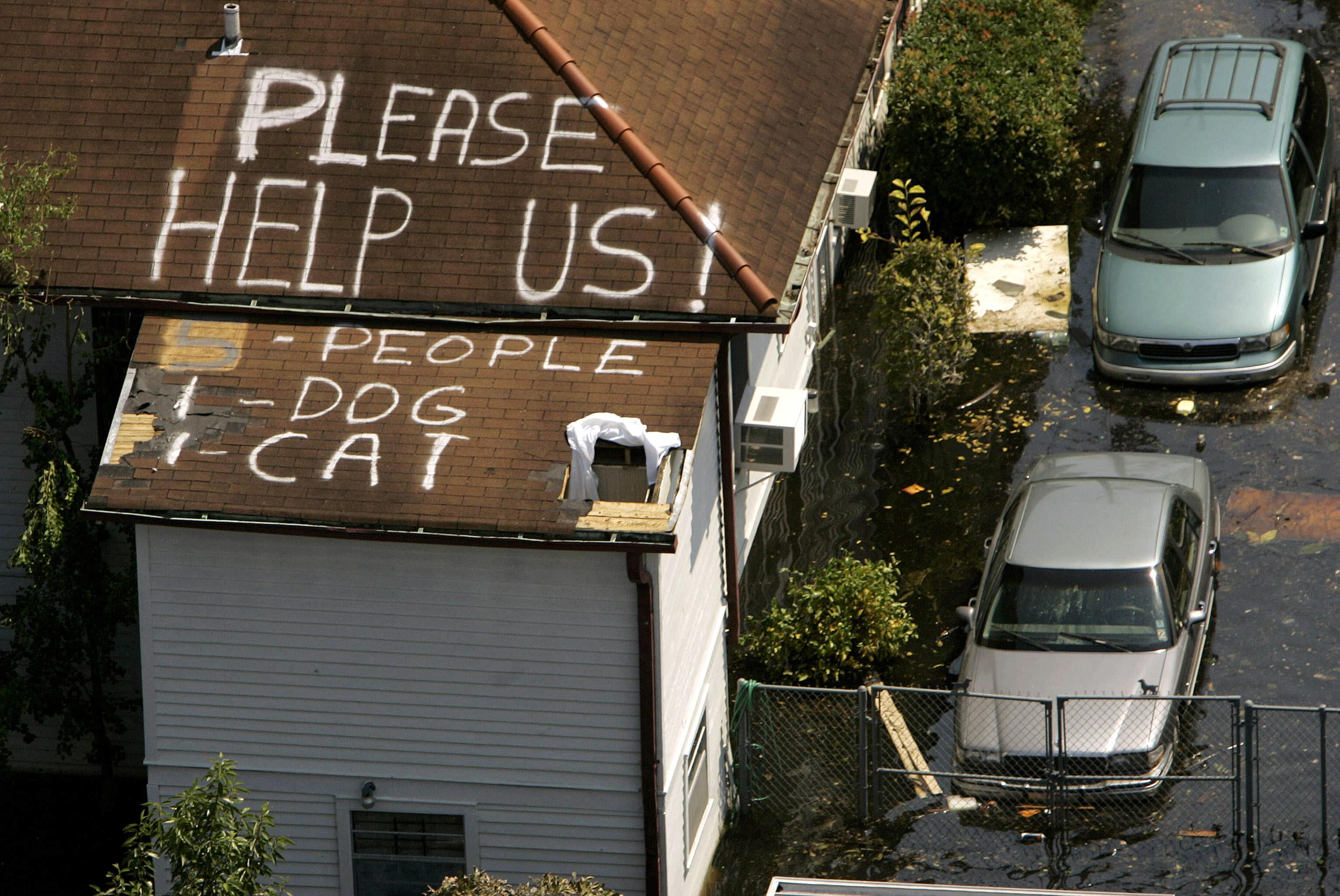 (FILES) A plea for help appears on the roof of a home flooded in the aftermath of Hurricane Katrina in New Orleans, Louisiana, on September 4, 2005.