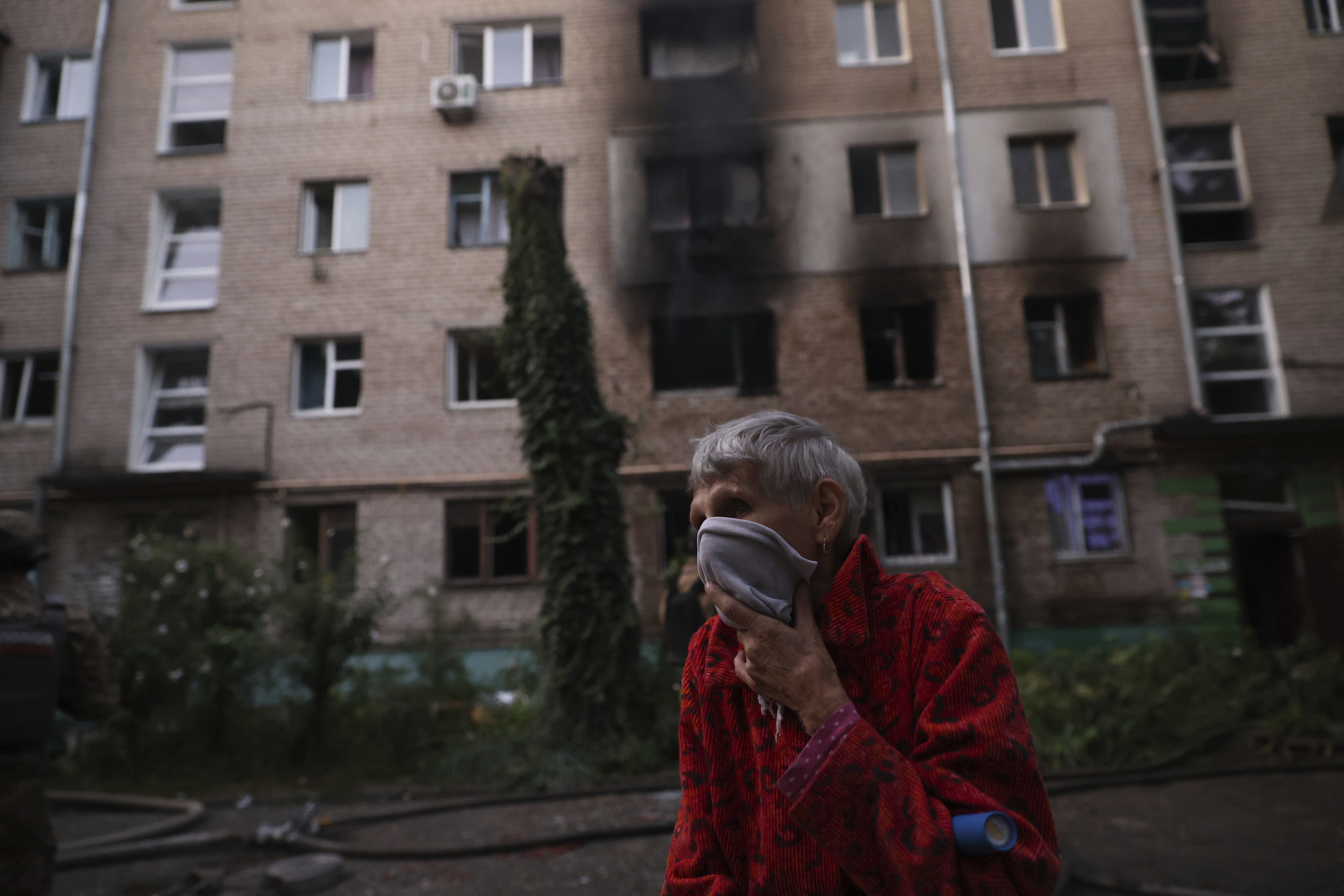 A resident stands near the resident's destroyed home following Russian air strike in Zaporizhzhia, Ukraine, Saturday, Aug. 30, 2025. (AP Photo/Kateryna Klochko)
