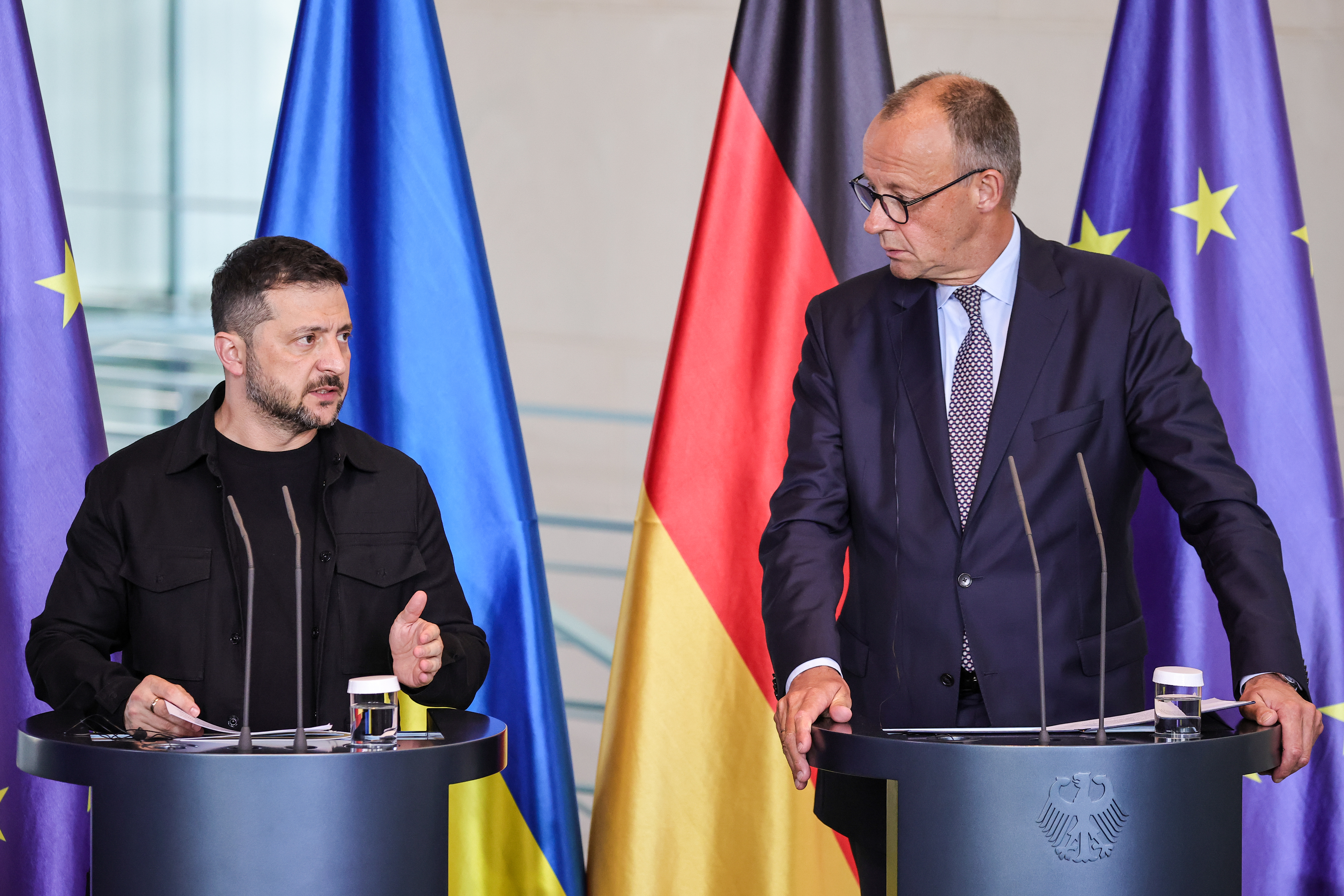 German Chancellor Friedrich Merz (R) and Ukrainian President Volodymyr Zelenskyy attend a joint press conference in Berlin after a virtual meeting with US President Donald Trump [Omer Messinger/Getty Images]
