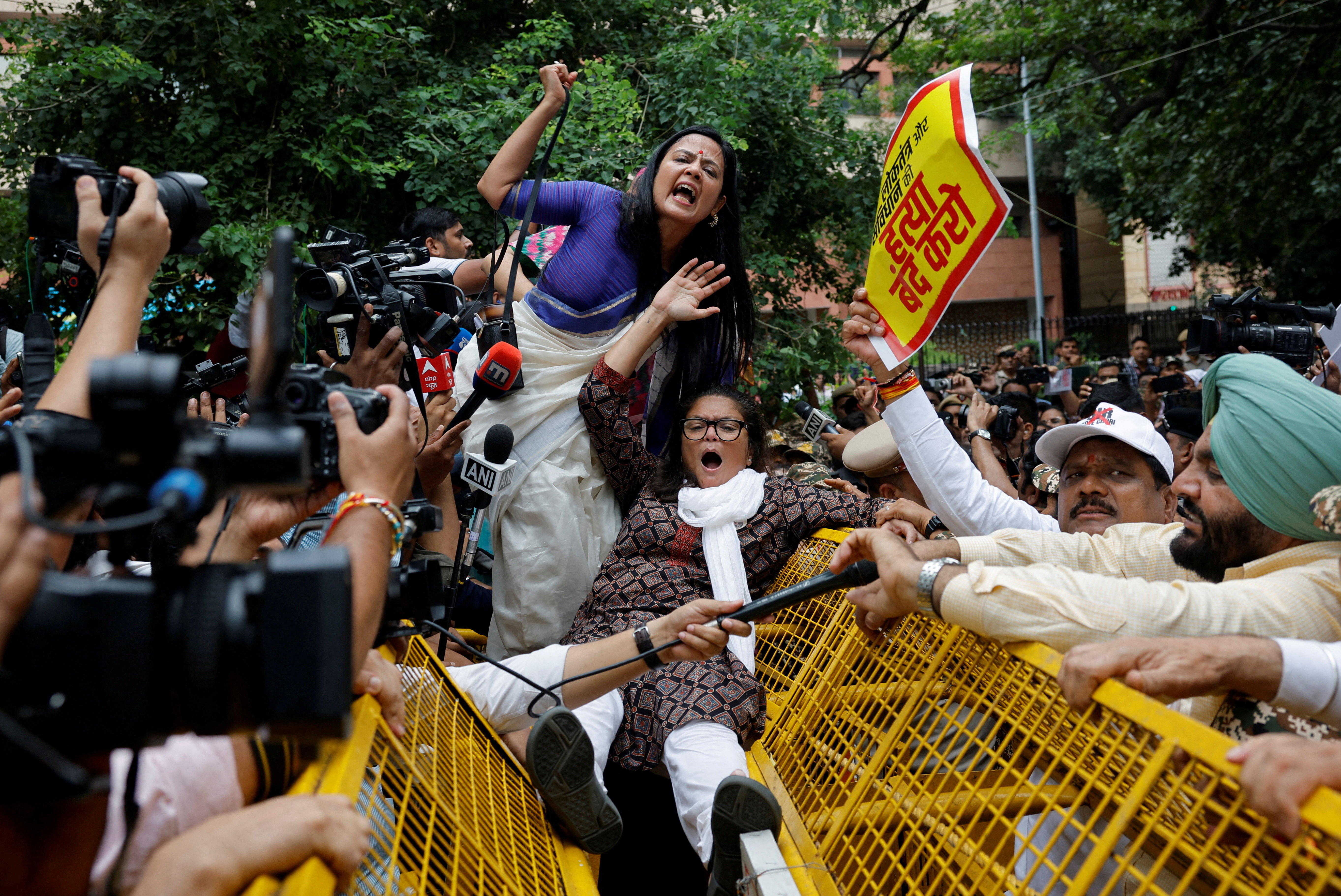 Indian opposition lawmakers shout slogans as they try to cross a police barricade during a protest against what they say are electoral malpractices, in New Delhi, India, August 11, 2025. REUTERS/Adnan Abidi TPX IMAGES OF THE DAY