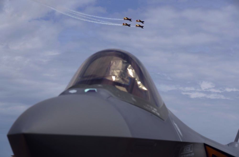 Four Romanian-made aerobatic airplanes YAK-52, formation named 'Aerobatic Yakkers' fly over an F-35 Lightning II 5-th generation US-made jet fighter during the first day of the Black Sea Defense & Aerospace Exhibition 2024 (BSDA'24) in Bucharest, Romania, 22 May 2024.