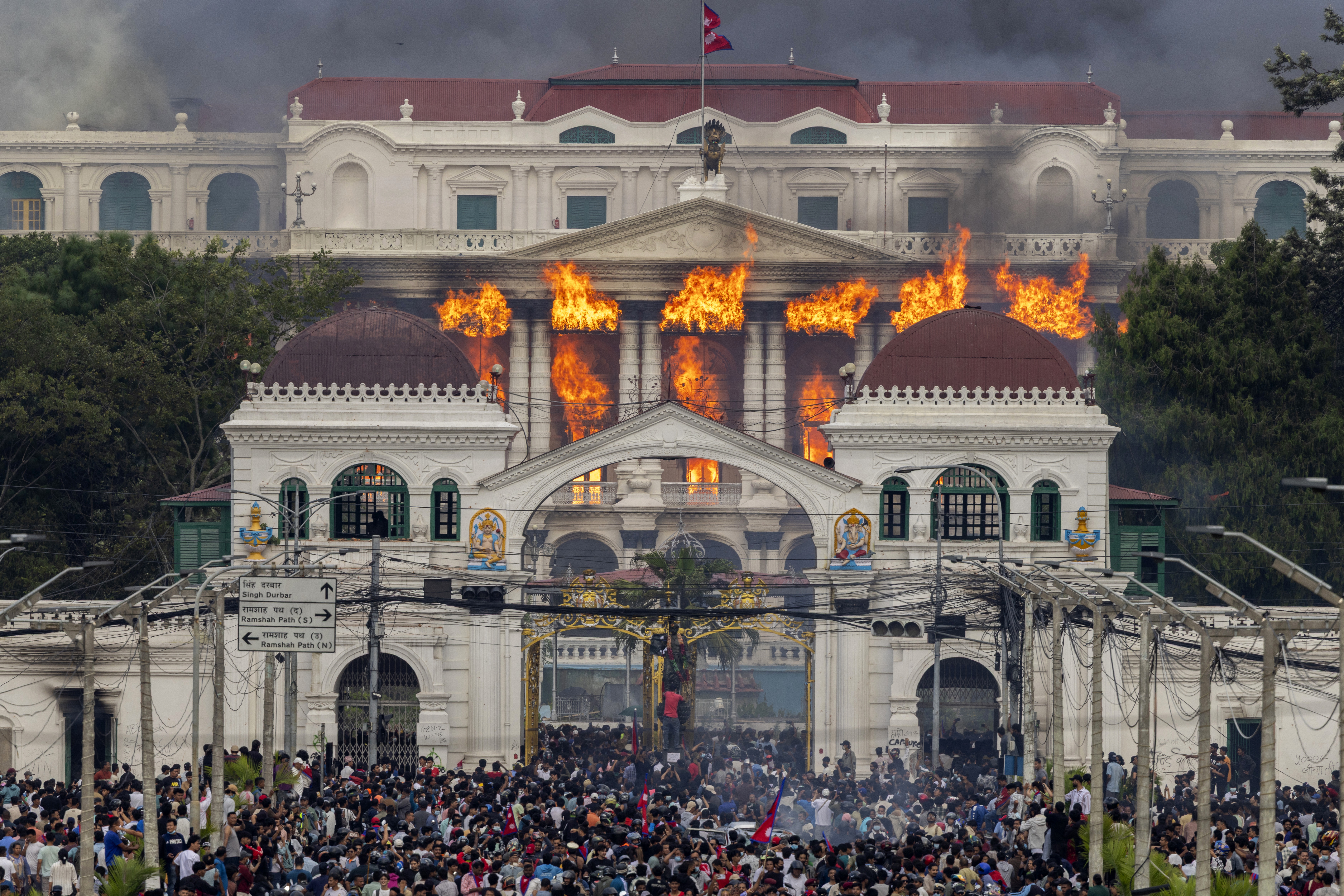 Protesters torch Nepal parliament as PM resigns amid turmoil