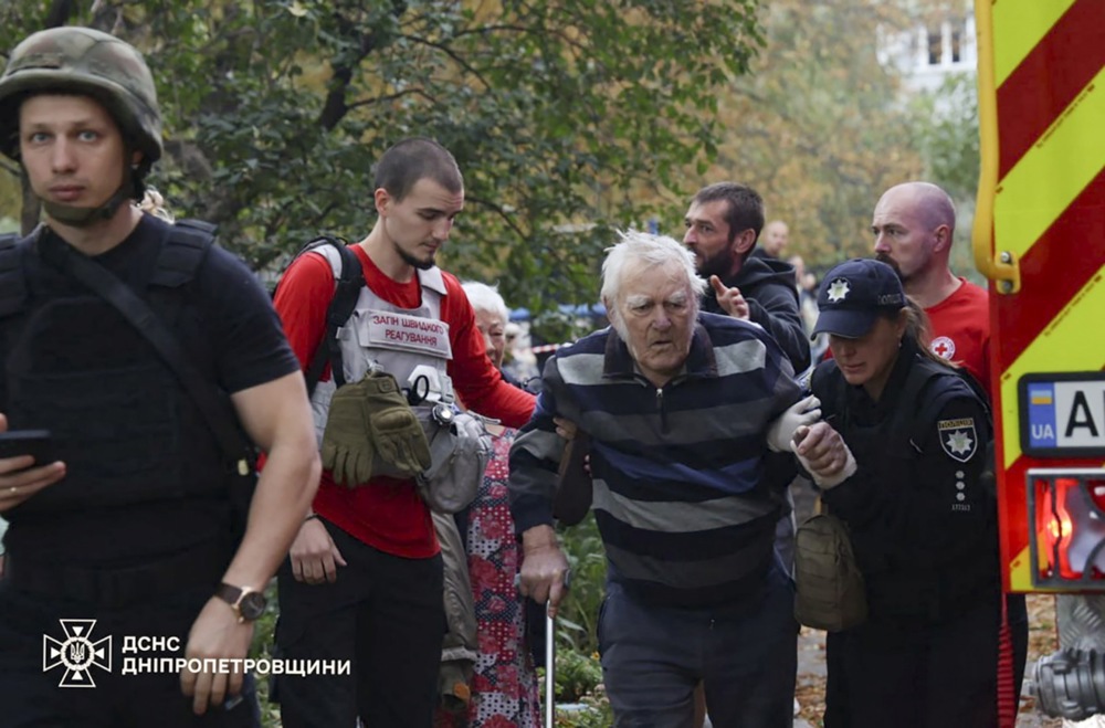 epa12391840 A handout picture made available by the State Emergency Service shows Ukrainian rescuers working at the site of a drone strike of a parking near a residential building in Dnipro, Ukraine, overnight 20 September 2025, amid the ongoing Russian invasion. At least three people died and dozens were injured after an overnight Russian combined attack around Ukraine with about 580 shock-drones and 40 missiles of different types, according to the State Emergency Service report. EPA/STATE EMERGENCY SERVICE HANDOUT HANDOUT EDITORIAL USE ONLY/NO SALES