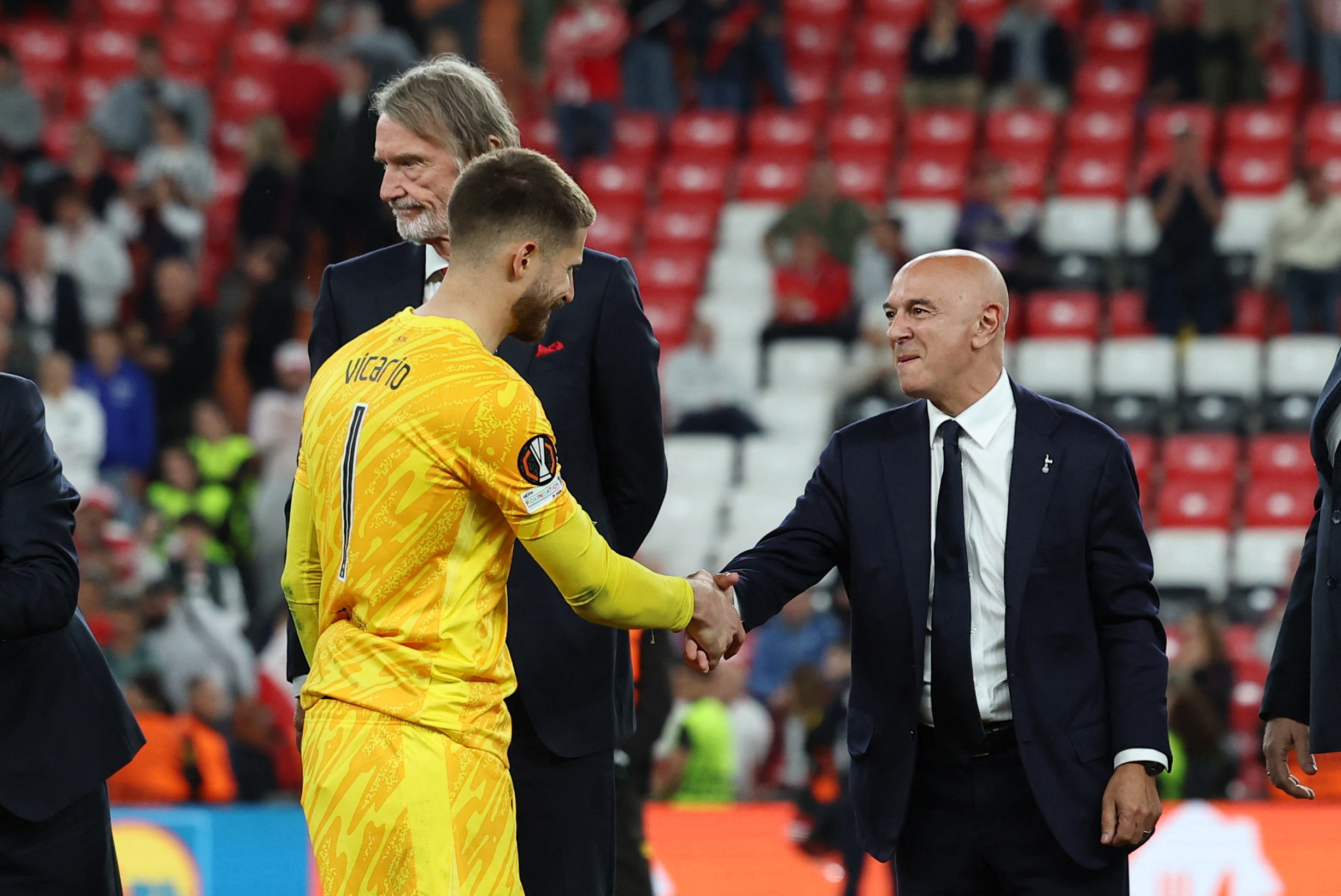 Tottenham Hotspur's Guglielmo Vicario celebrates with chairman Daniel Levy after winning the Europa League