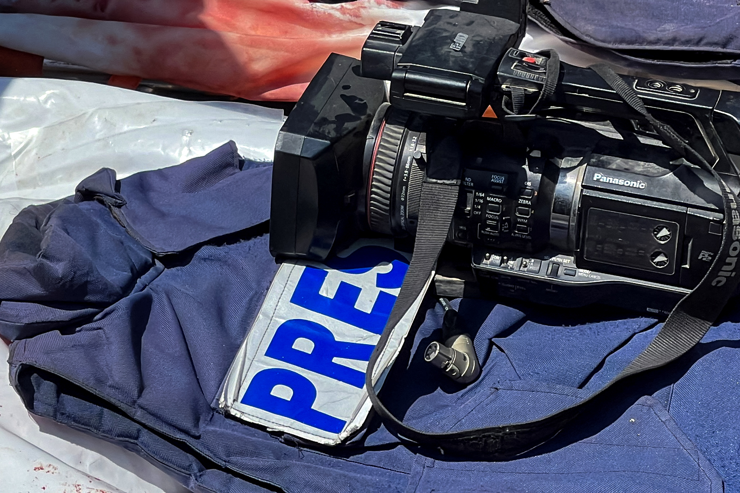 SENSITIVE MATERIAL. THIS IMAGE MAY OFFEND OR DISTURB Flak jackets and cameras are placed on the bodies of journalists Mohammed Salama, who Qatar-based Al Jazeera said worked for the broadcaster, and Hussam al-Masri, who was a contractor for Reuters, after they were killed in Israeli strikes on Nasser hospital, in Khan Younis in the southern Gaza Strip, August 25, 2025. REUTERS/Stringer TPX IMAGES OF THE DAY