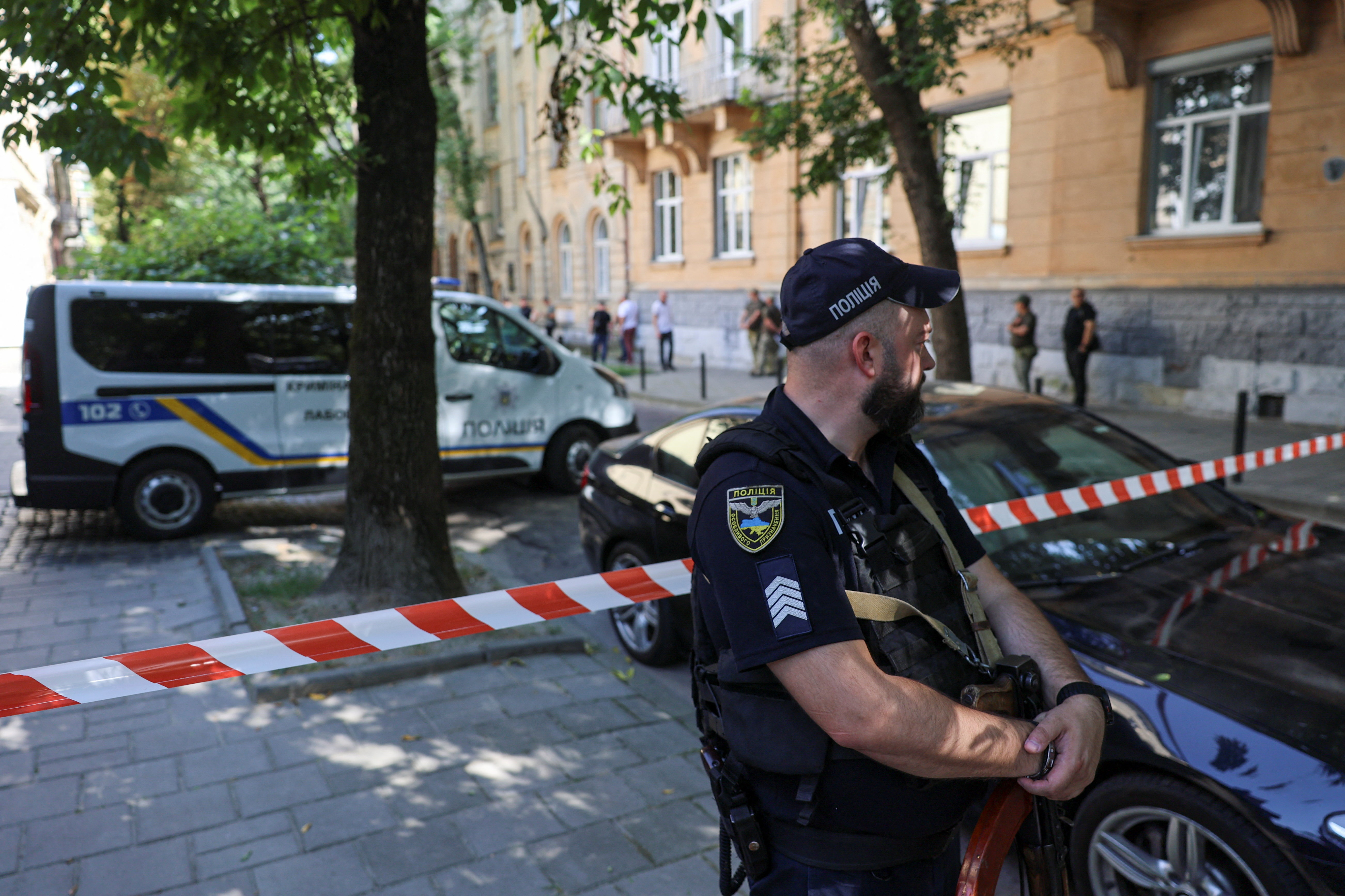 A police officer guards at the site of a murder of former Ukrainian parliamentary speaker Andriy Parubiy