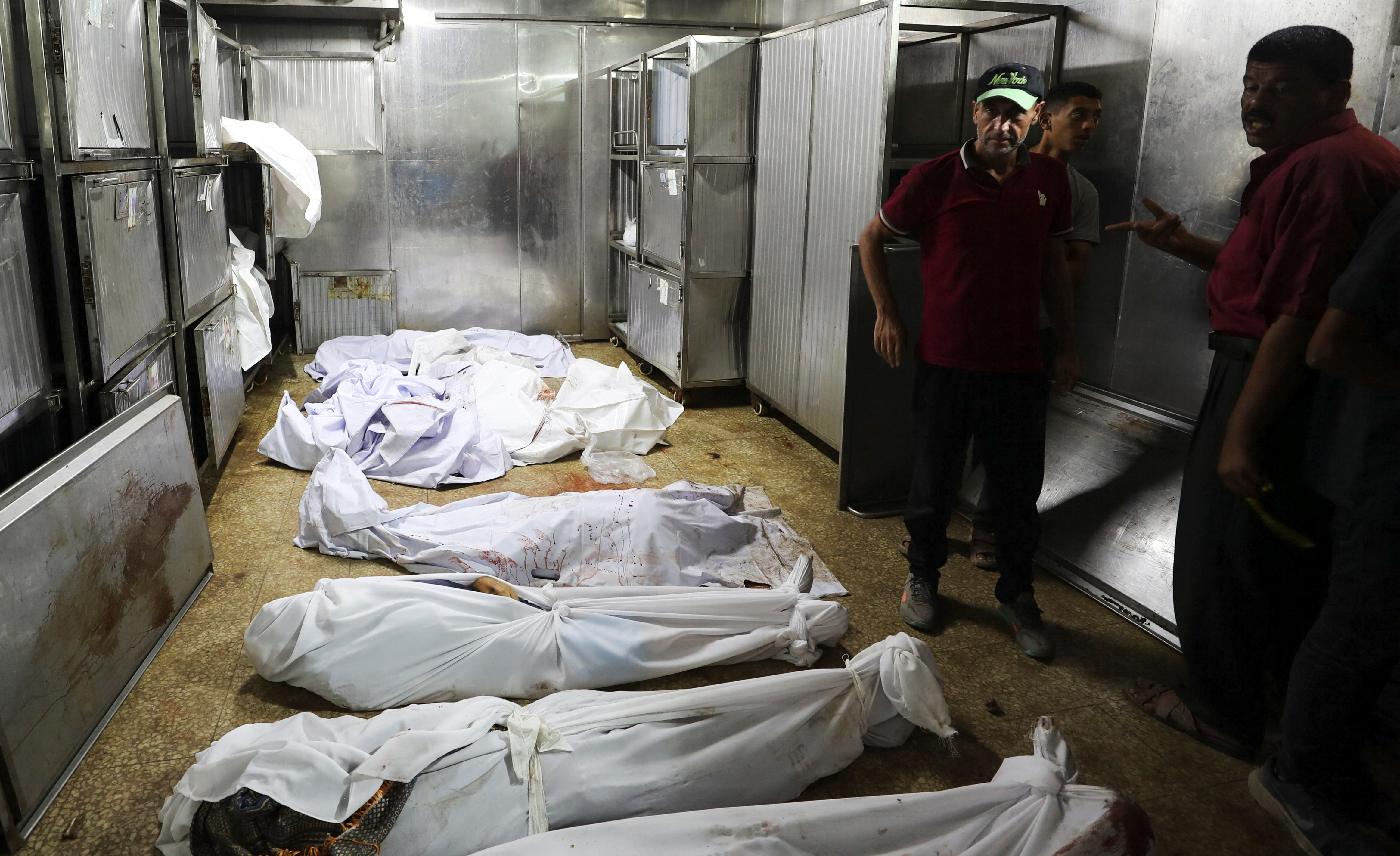 Mourners stand next to the bodies of Palestinians killed in overnight Israeli strikes, according to medics, during the funeral at Al-Shifa Hospital in Gaza City, September 2, 2025. [Dawoud Abu Alkas/Reuters]