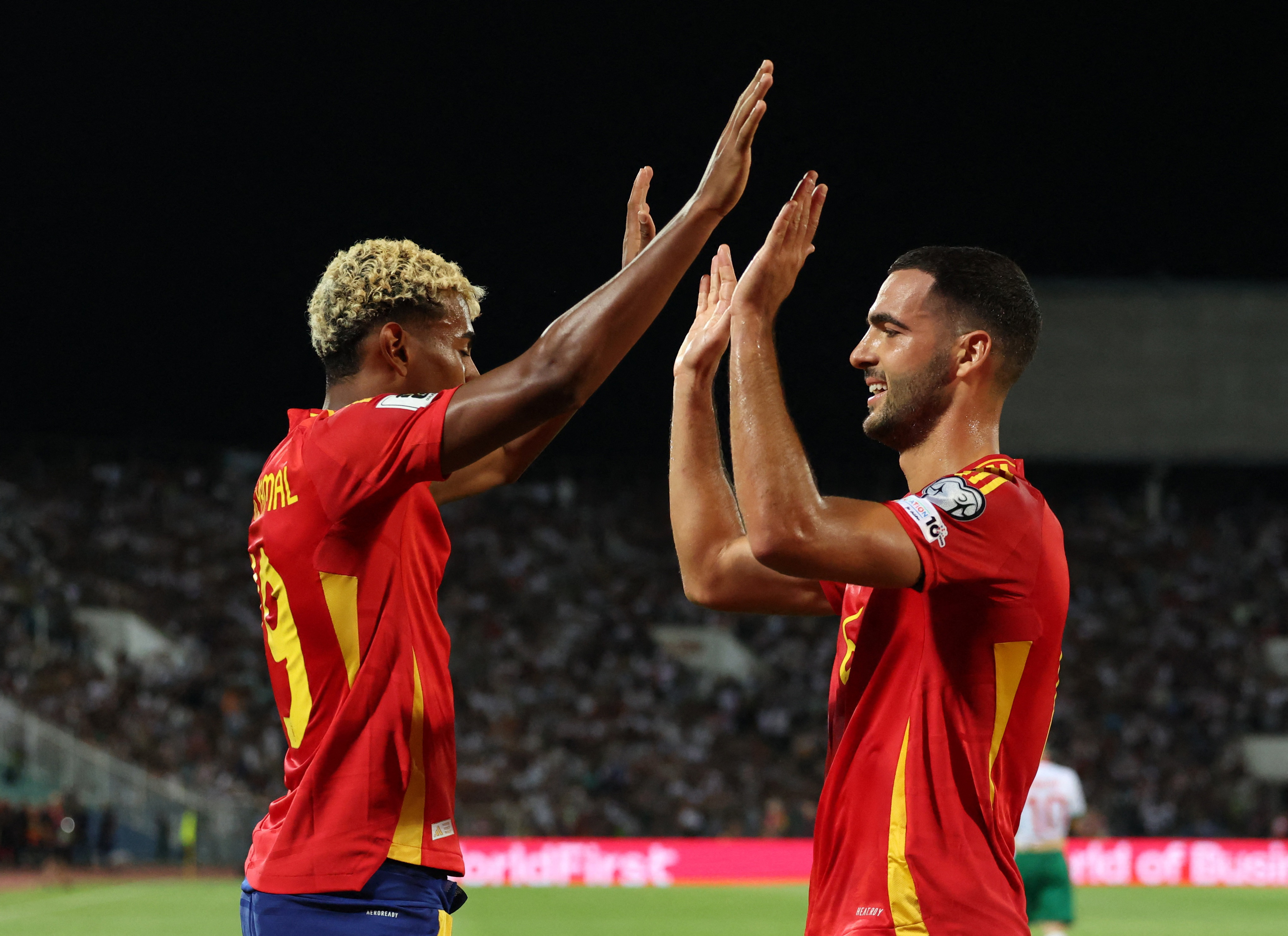 Spain's Mikel Merino celebrates scoring their third goal with Spain's Lamine Yamal