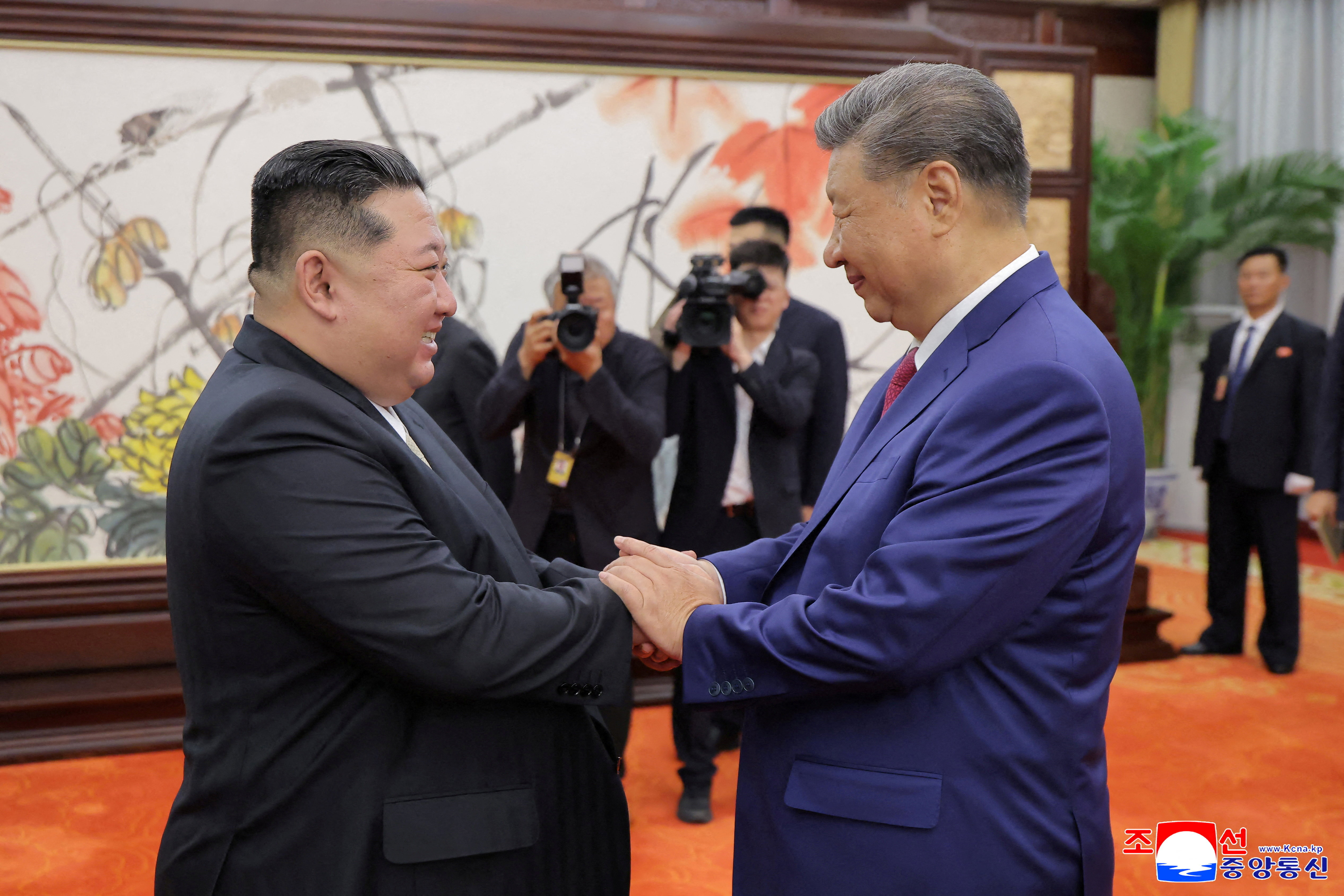North Korean leader Kim Jong Un and Chinese President Xi Jinping shake hands on the day of their bilateral summit in Beijing, China, September 4, 2025, in this picture released by North Korea's official Korean Central News Agency. KCNA via REUTERS ATTENTION EDITORS - THIS IMAGE WAS PROVIDED BY A THIRD PARTY. REUTERS IS UNABLE TO INDEPENDENTLY VERIFY THIS IMAGE. NO THIRD PARTY SALES. SOUTH KOREA OUT. NO COMMERCIAL OR EDITORIAL SALES IN SOUTH KOREA.