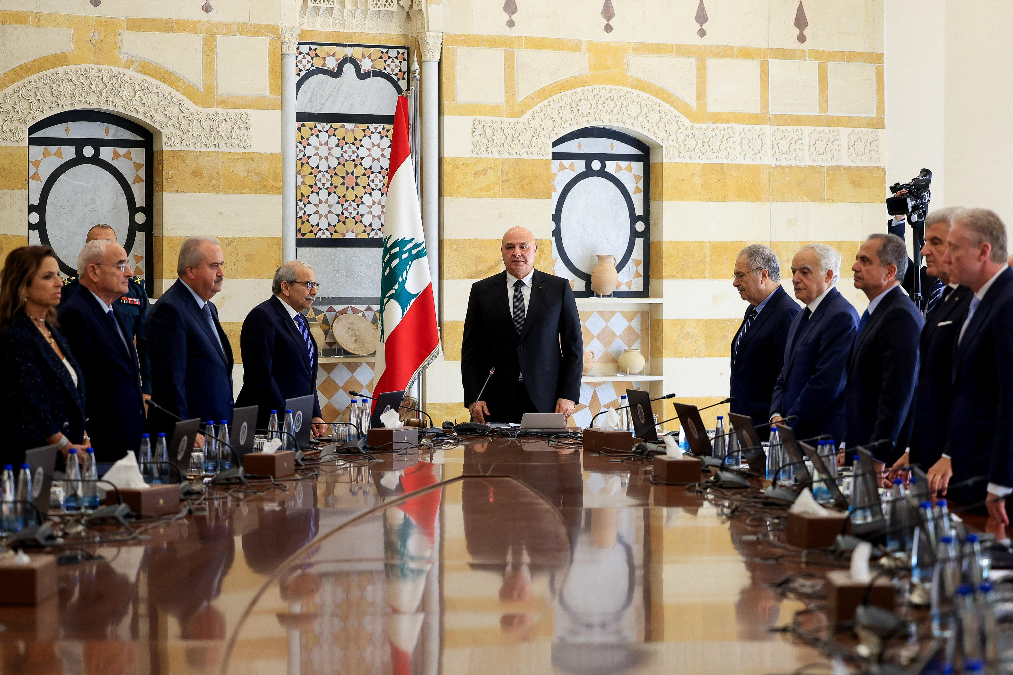 Lebanese President Joseph Aoun, Prime Minister Nawaf Salam and members of the cabinet stand as they attend a cabinet session to discuss the army's plan to disarm Hezbollah, at the Presidential Palace in Baabda, Lebanon, September 5, 2025. 