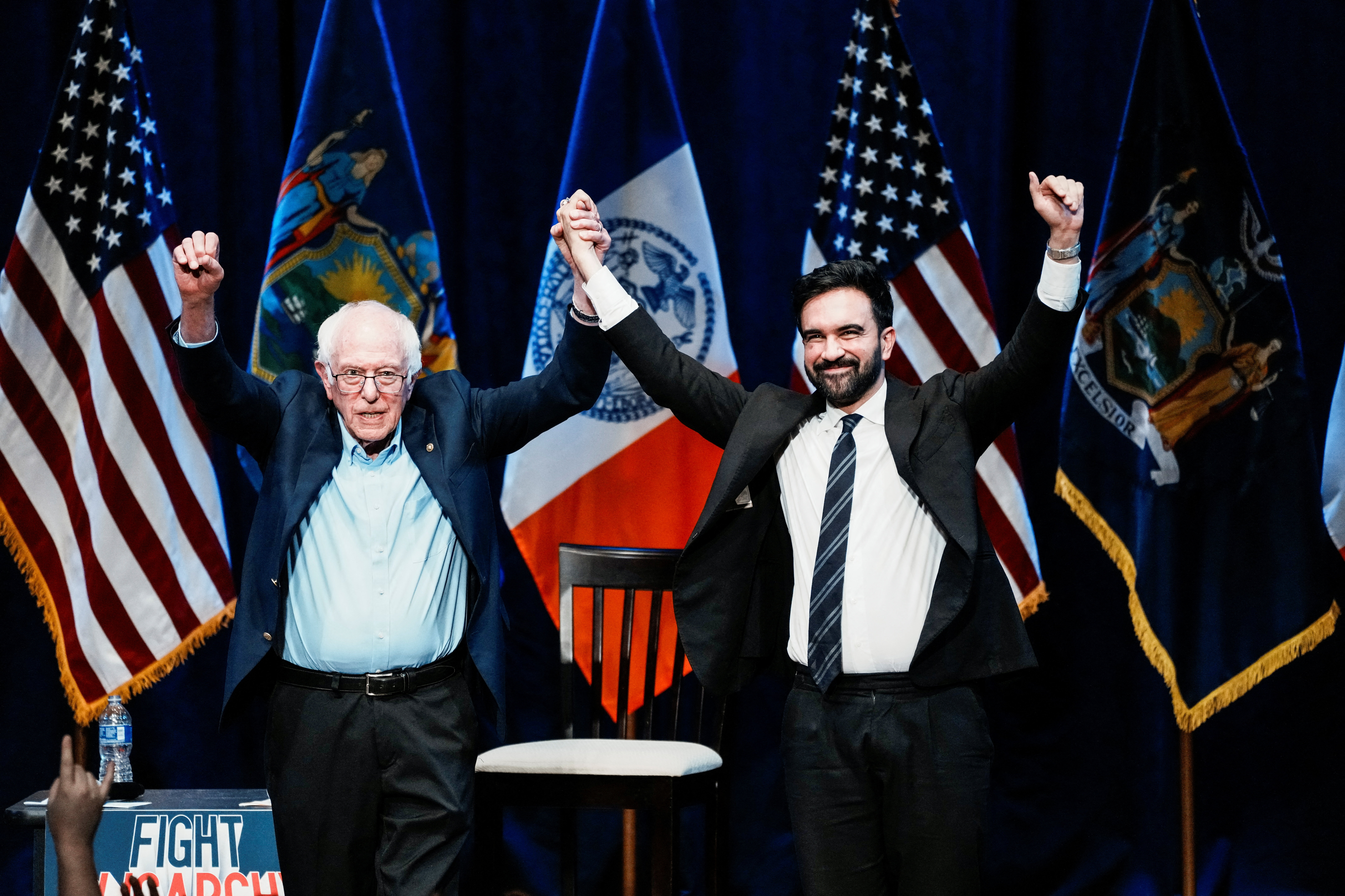 U.S. Senator Bernie Sanders and New York mayor Zohran Mamdani gesture to attendees at the end of a town hall meeting in Brooklyn, New York [File: Eduardo Munoz/Reuters]