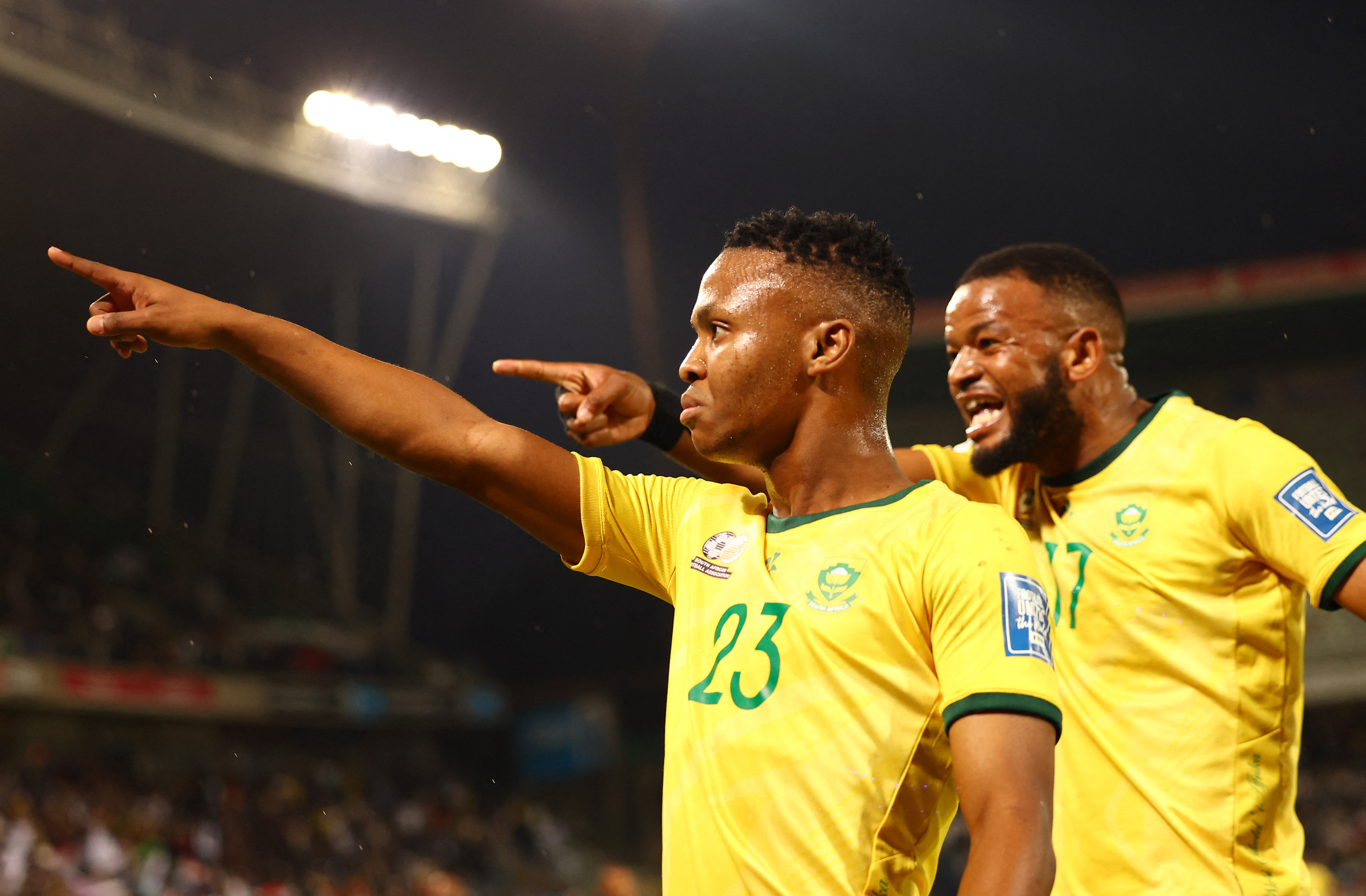South Africa's Mohau Nkota celebrates with teammates after Nigeria's William Troost-Ekong scored an own goal