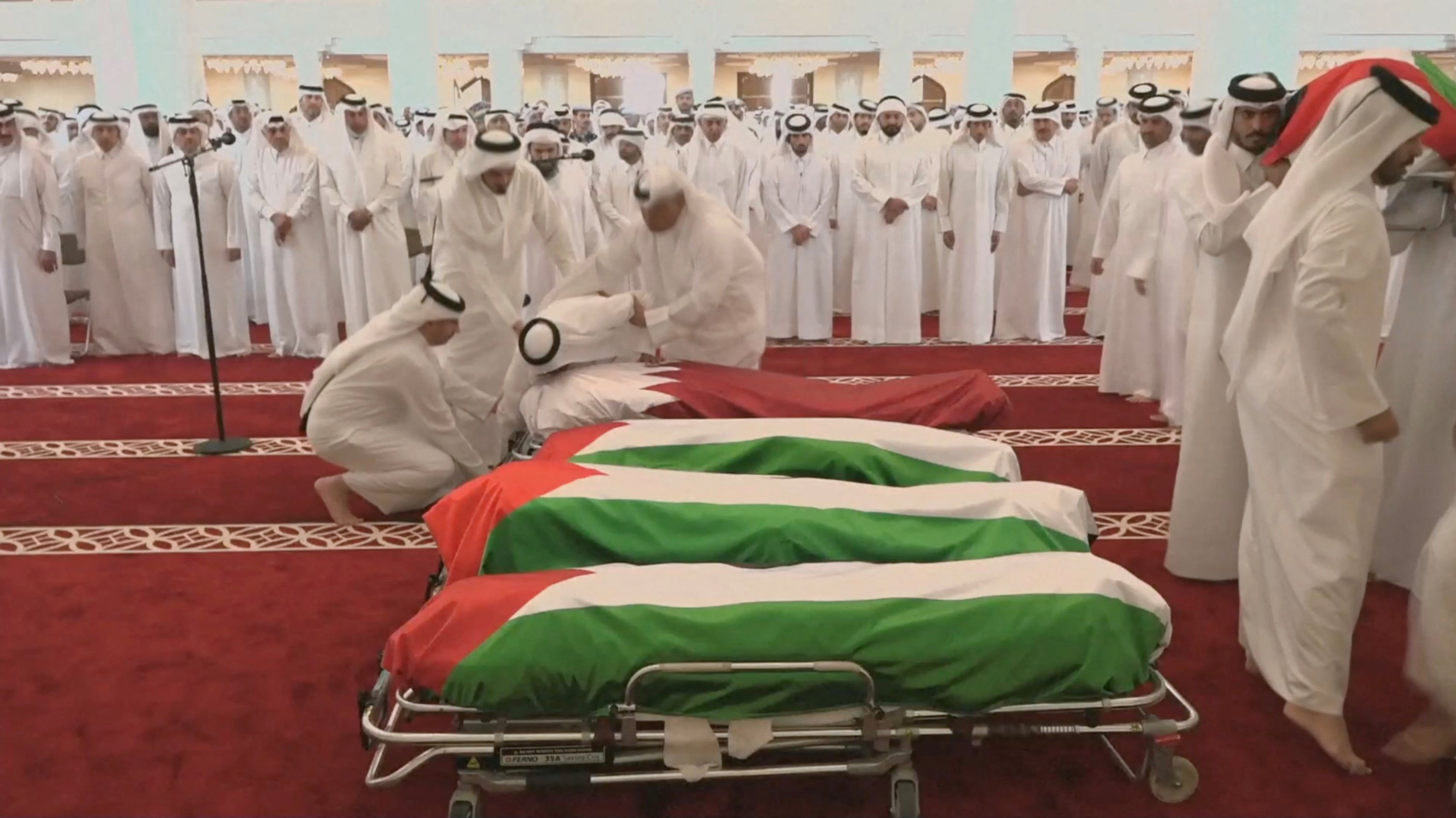 People attend a funeral held for those killed by an Israeli attack in Doha [Qatar TV/Reuters]