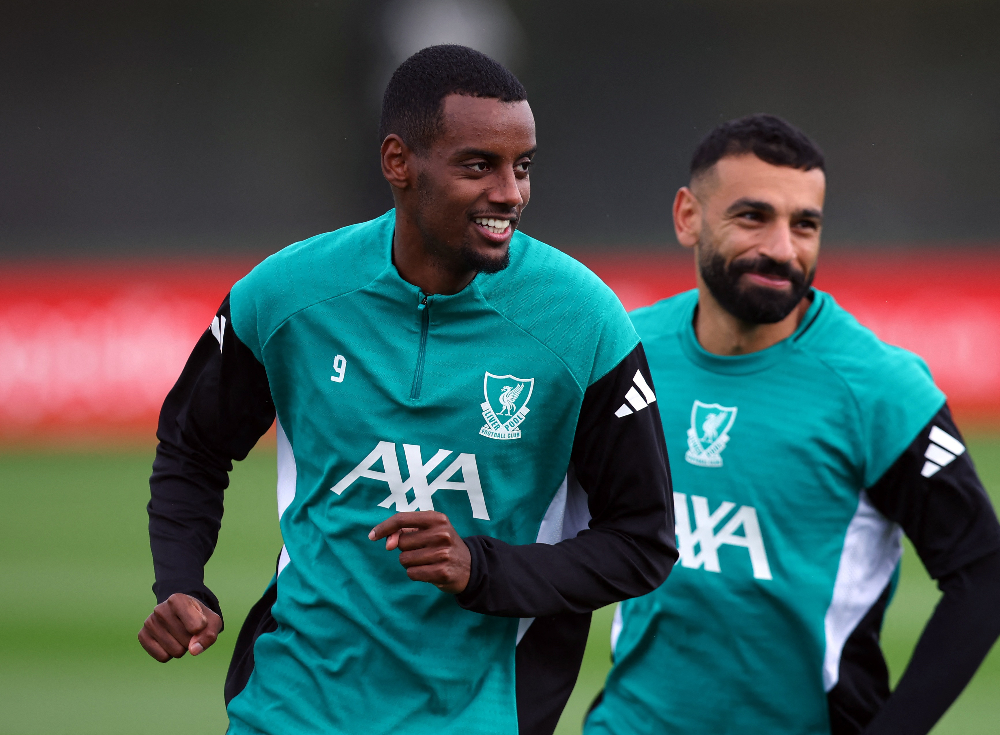 Mohamed Salah and Alexander Isak in action.