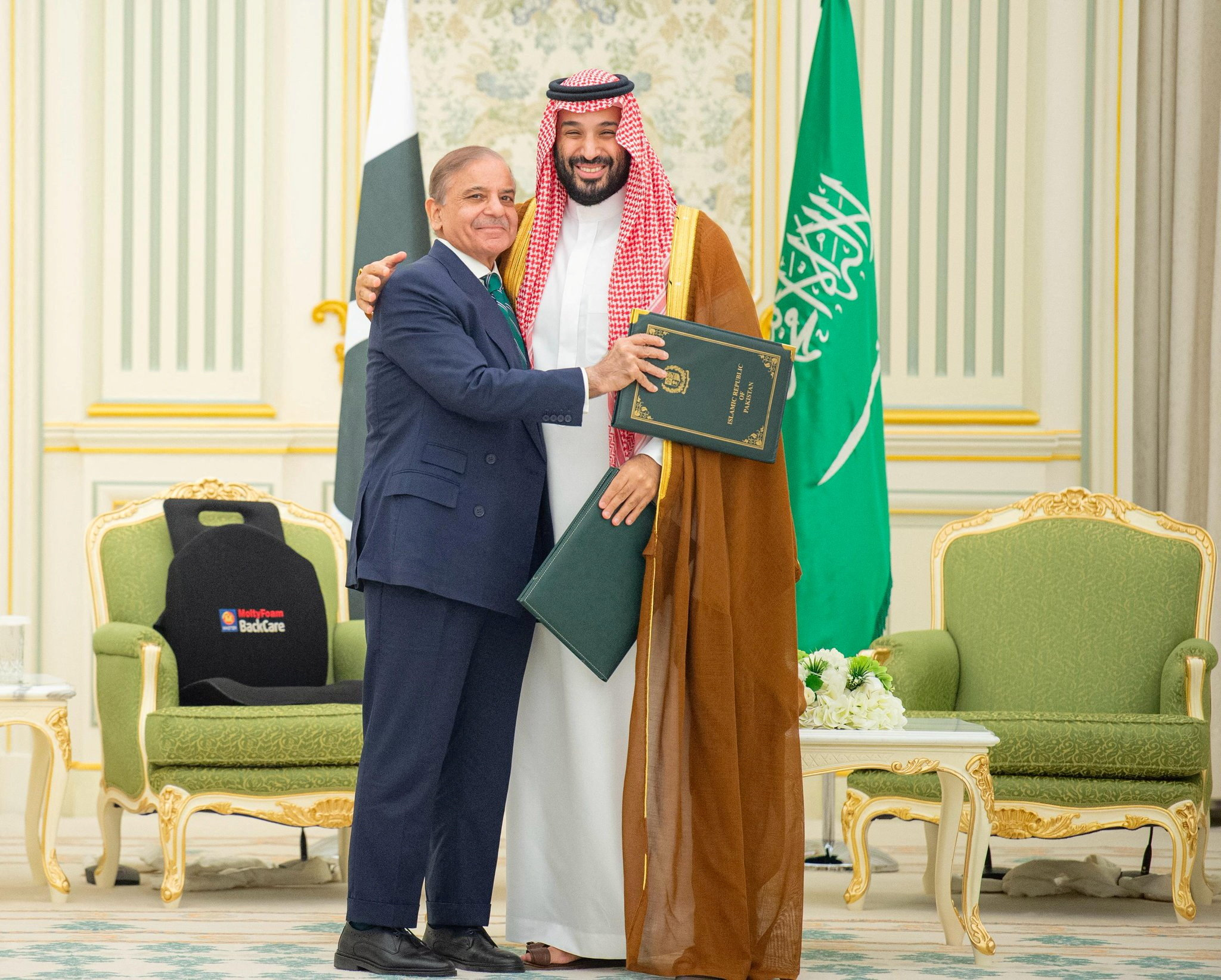 Saudi Crown Prince Mohammed bin Salman and Pakistan Prime Minister Shehbaz Sharif embrace each other on the day they sign a defence agreement