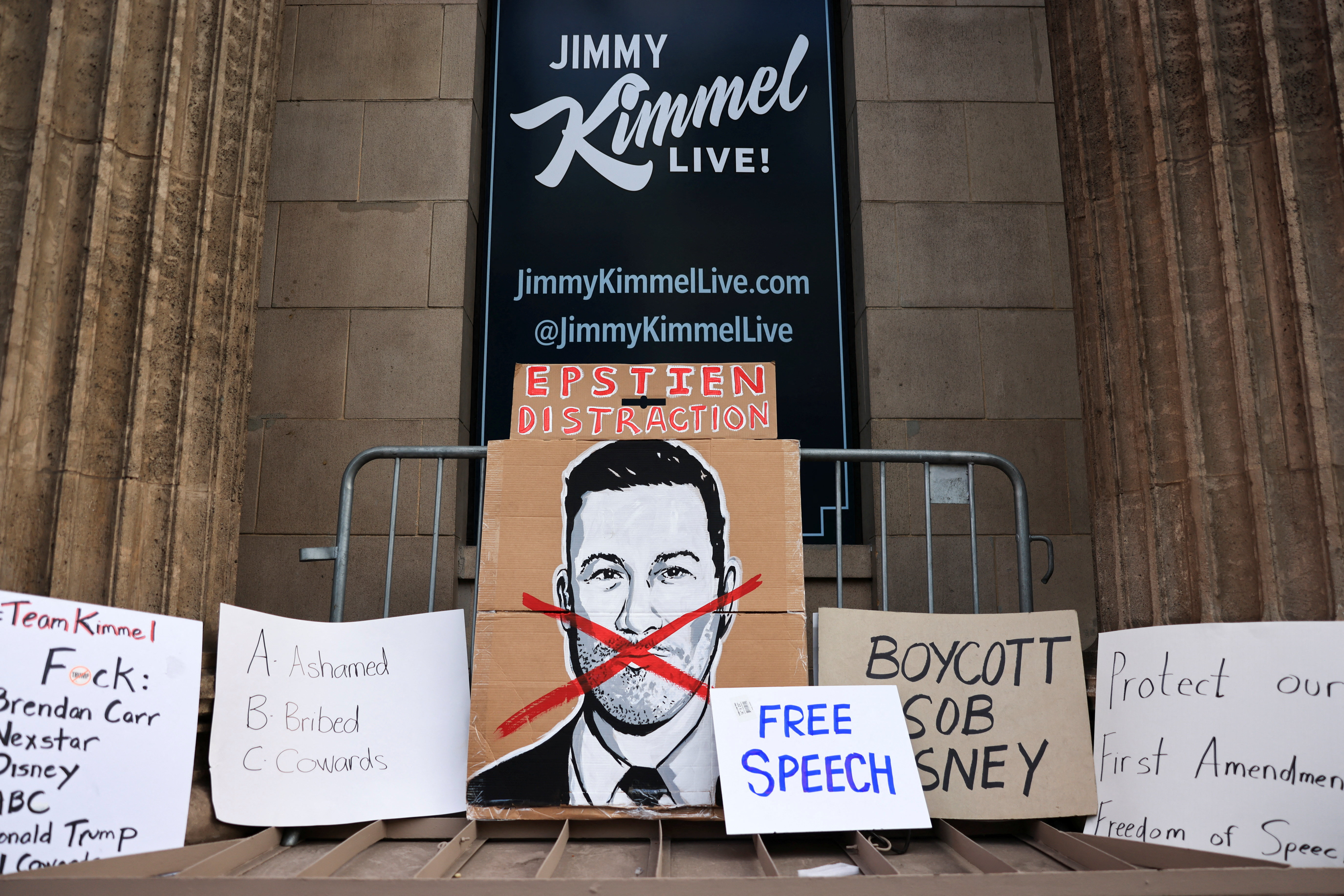 Signs are arranged during a protest at the El Capitan Entertainment Centre, where "Jimmy Kimmel Live!" was recorded for broadcast, following his suspension for remarks he made regarding Charlie Kirk’s assassination, on Hollywood Boulevard in Los Angeles, California, U.S. September 18, 2025 [David Swanson/Reuters]