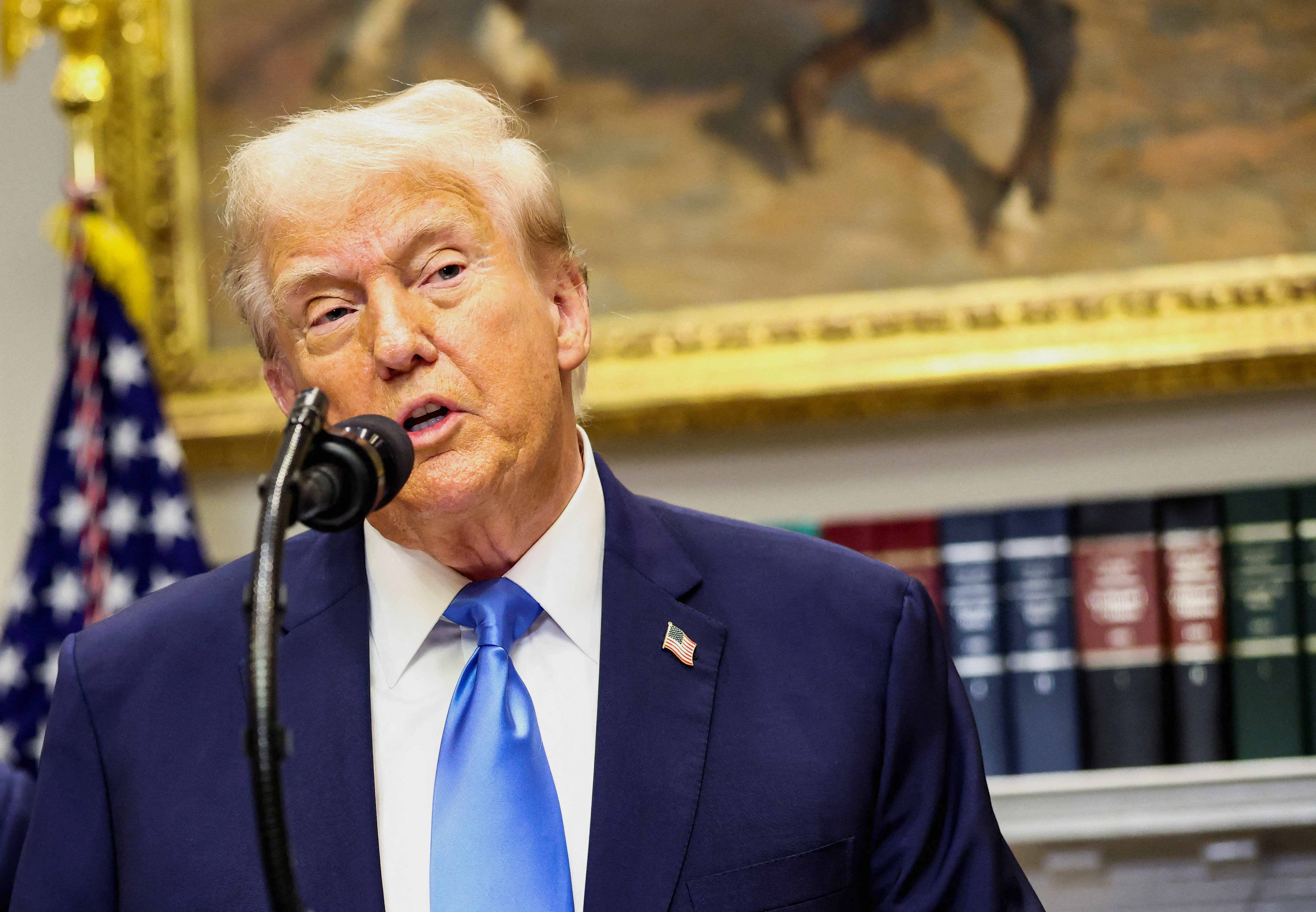 US President Donald Trump makes an announcement at the White House.