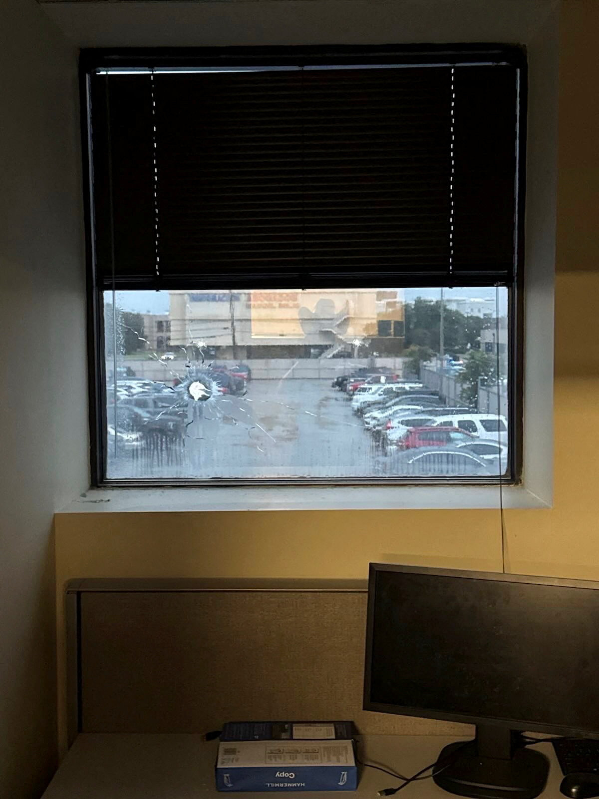 A broken window is seen in this picture released on social media by Assistant Secretary for Public Affairs