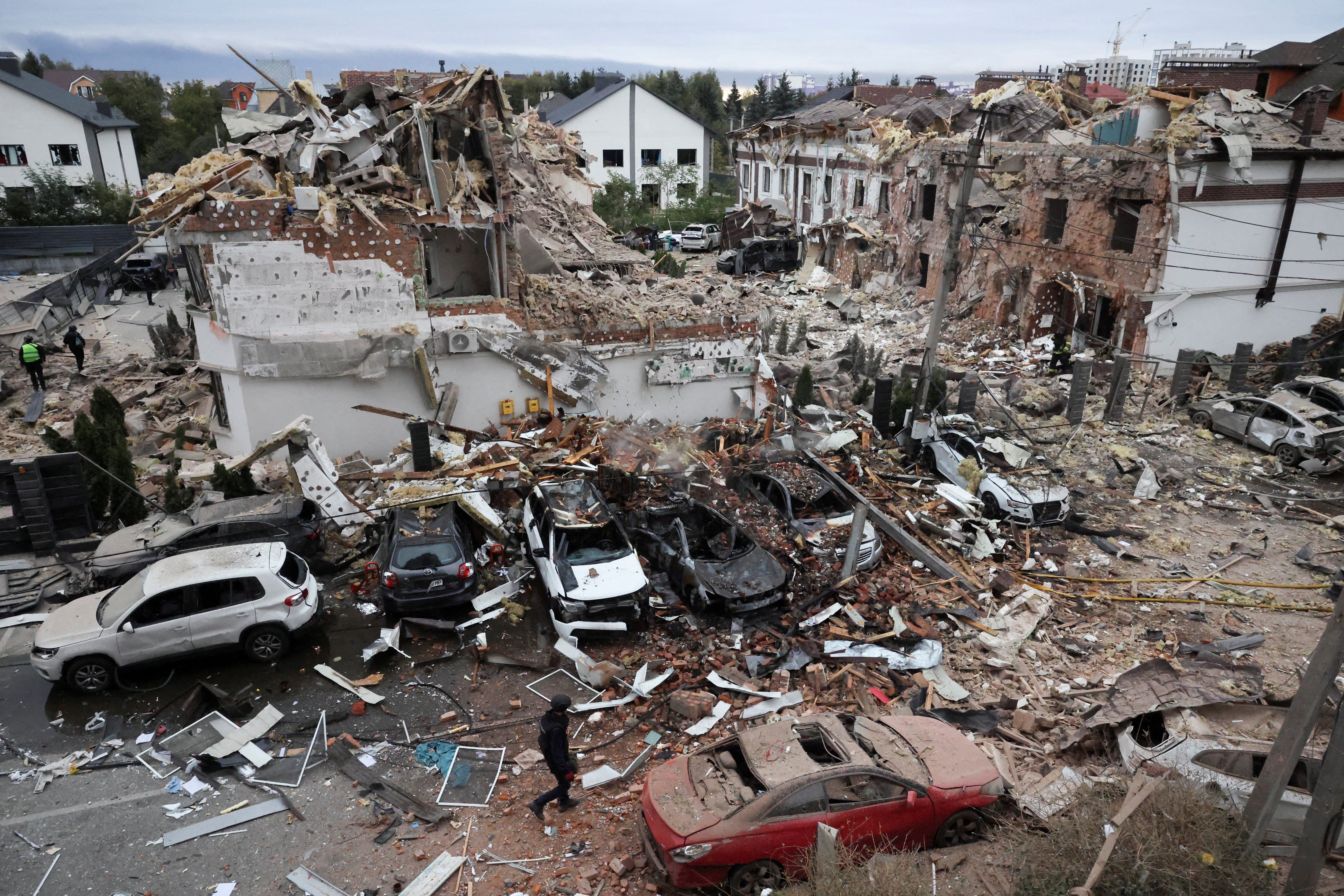 Emergency workers operate at an impact site in a residential neighbourhood after Russian drone and missile attacks in Kyiv, Ukraine, September 28, 2025. REUTERS/Thomas Peter TPX IMAGES OF THE DAY