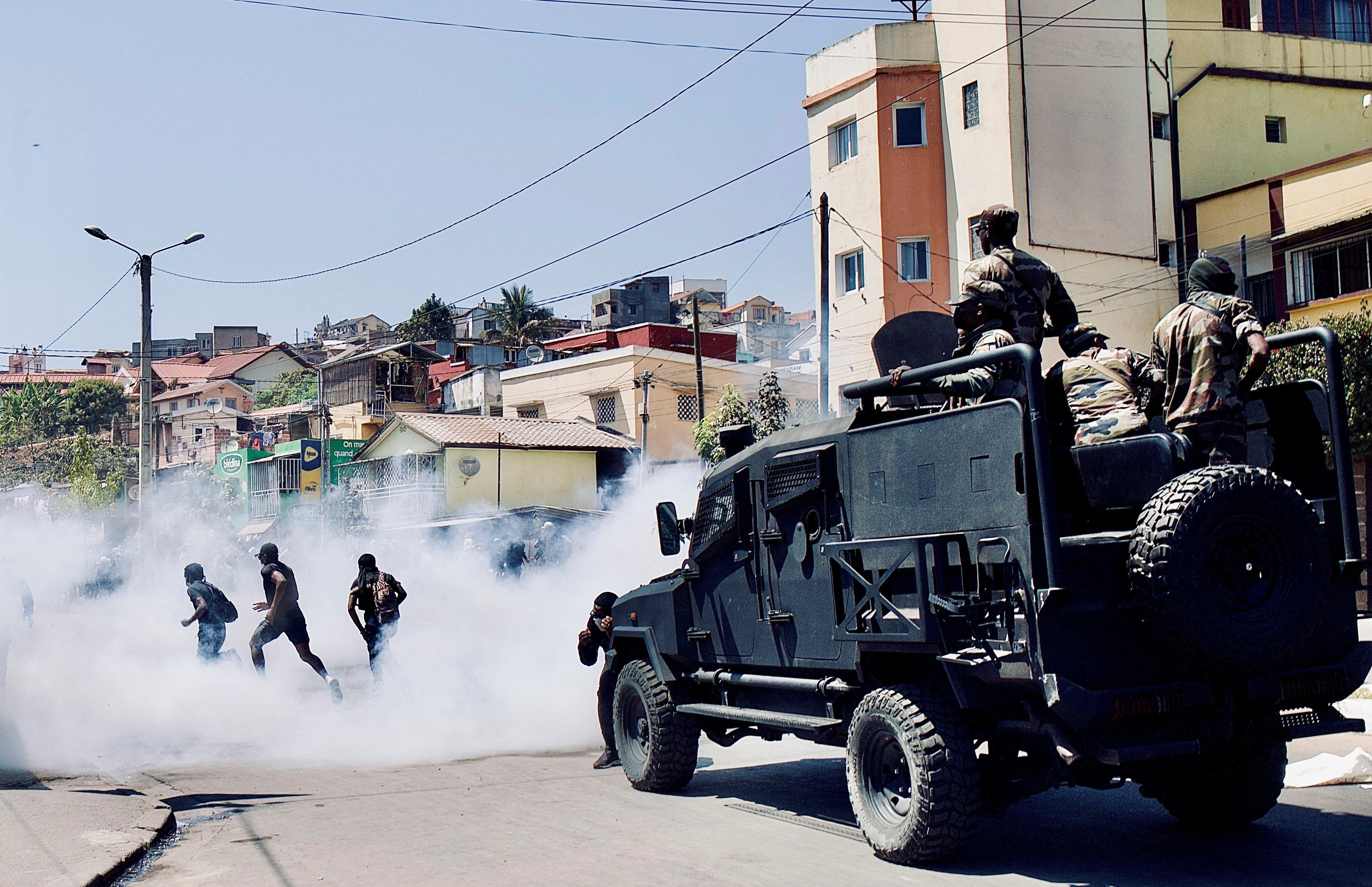 Riot police use tear gas to disperse protesters during a demonstration against frequent power outages and water shortages, near the University of Antananarivo, Madagascar September 29, 2025 [Zo Andrianjafy/Reuters]