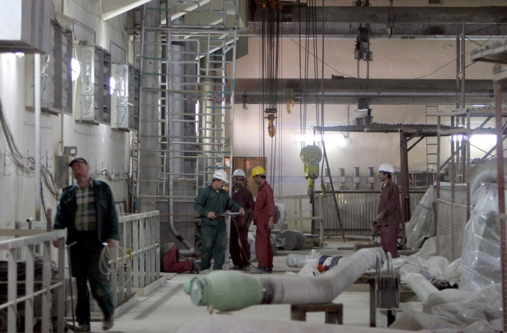 Technicians working inside a nuclear power plant.