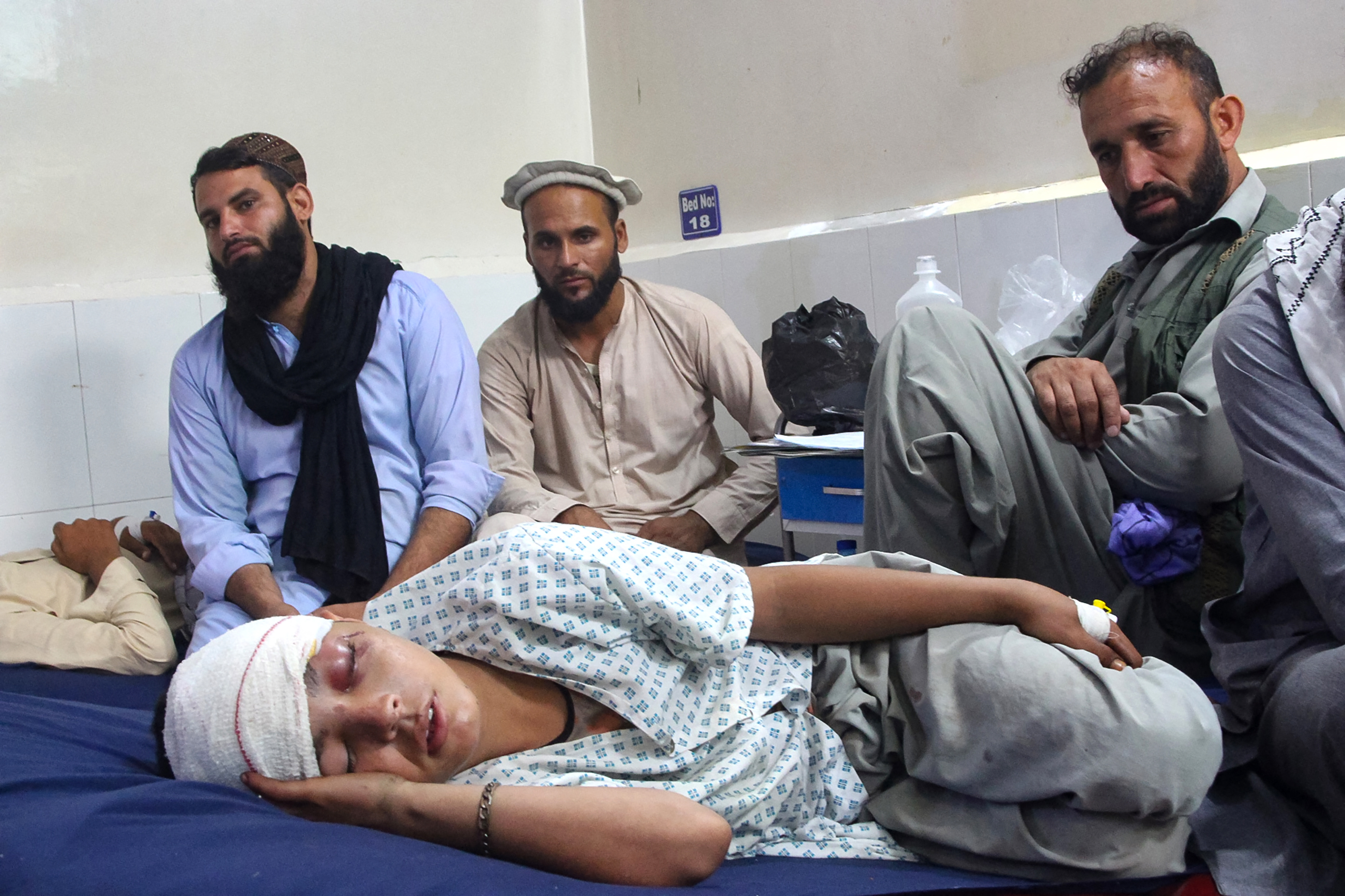 An injured Afghan boy receives treatment at a hospital after an earthquake in Jalalabad