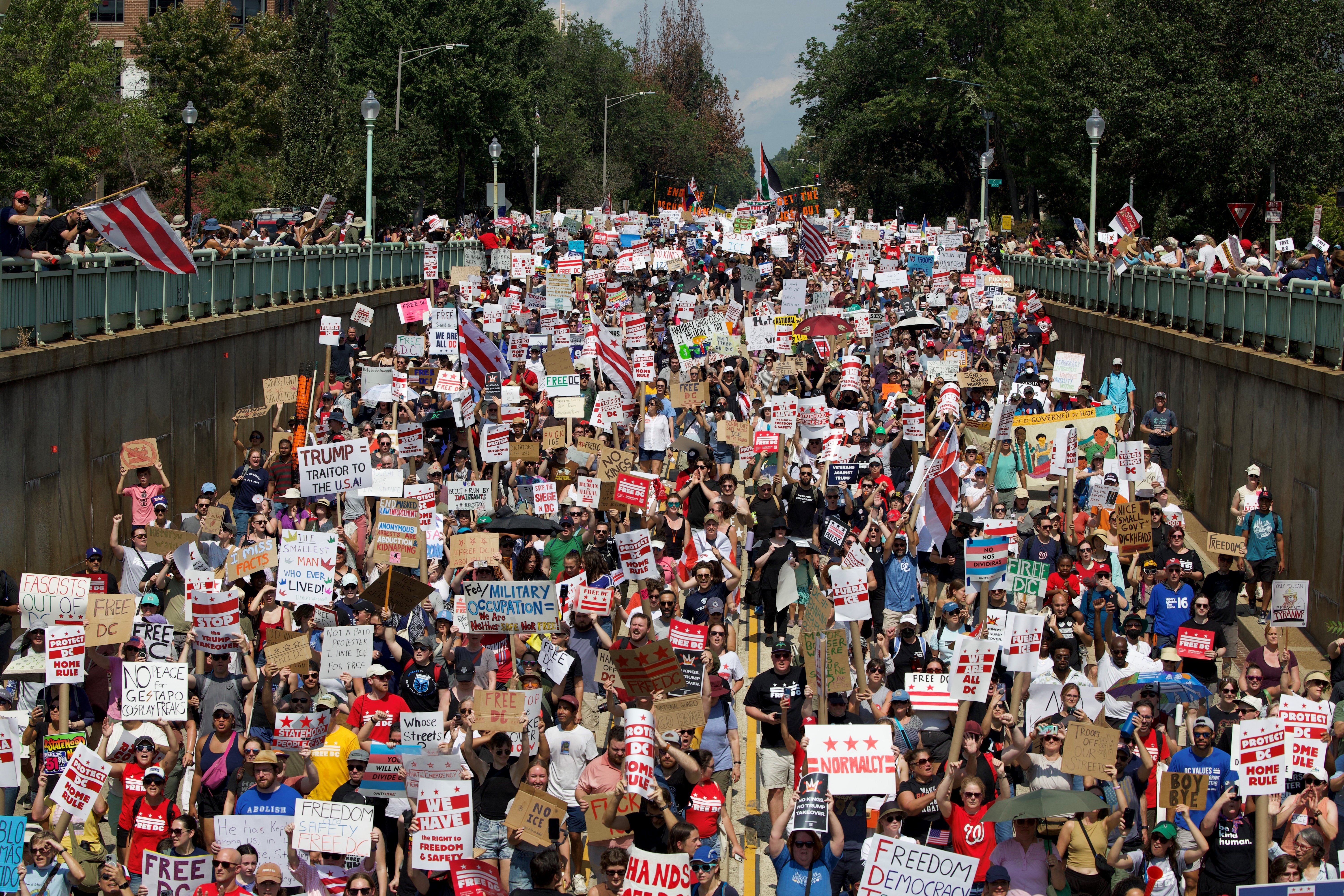 People participate in the "We Are All DC" national march in solidarity with DC communities and calling for an end to the deployment of National Guard troops in Washington, DC, on September 6, 2025. (Photo by Amid FARAHI / AFP)