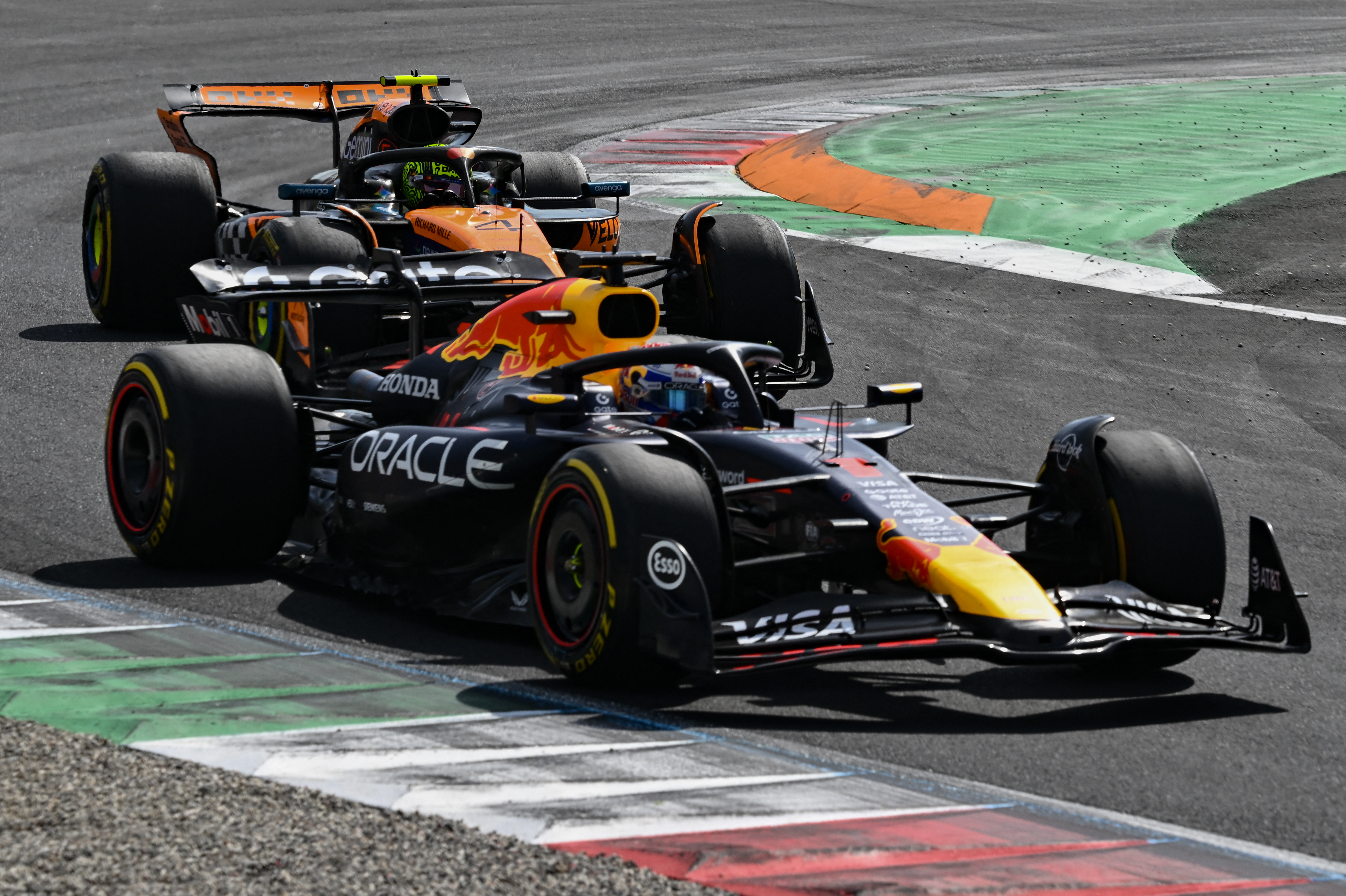 Max Verstappen and Lando Norris in action.