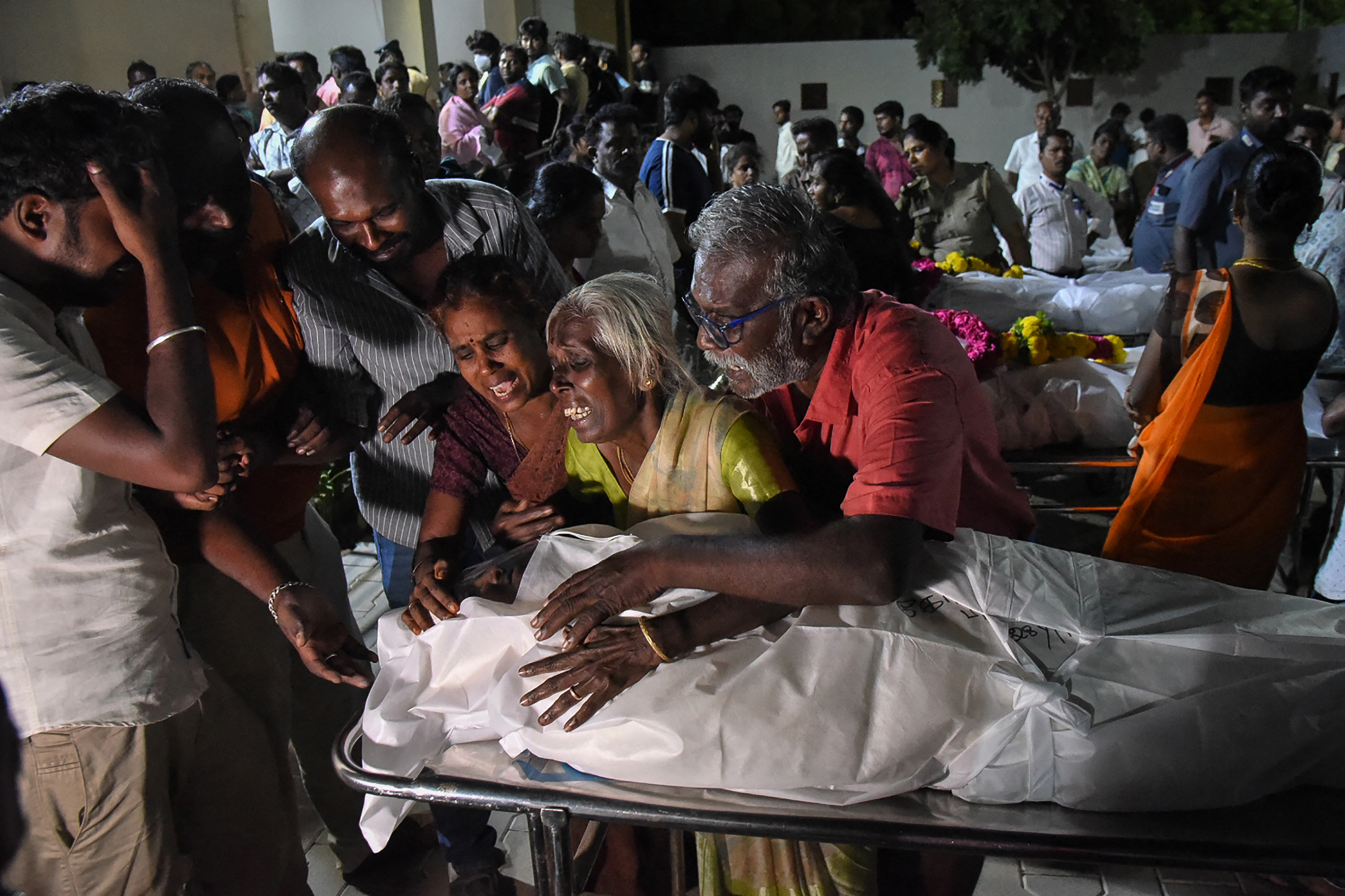 Relatives mourn after receiving the dead body of a victim who was killed in a stampede that broke out during a campaign rally last evening in the Karur district, in the Indian state of Tamil Nadu, on September 28, 2025. At least 36 people were killed on September 27 after a stampede broke out at a campaign rally of popular actor-turned-politician Vijay in Tamil Nadu, the state's chief minister said. (Photo by AFP)