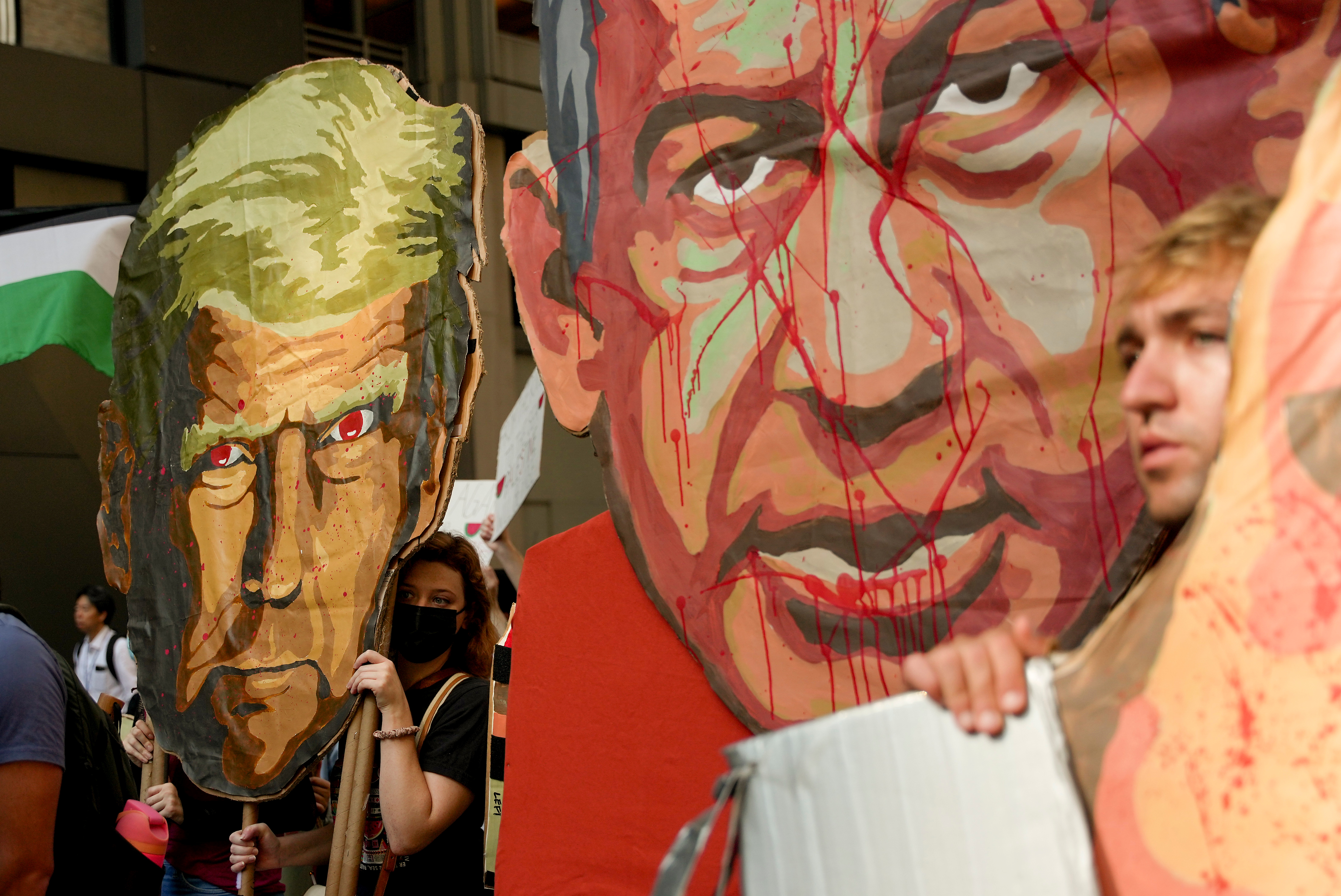 People carry caricature heads of U.S. President Donald Trump, left, and Israeli Prime Minister Benjamin Netanyahu as they march down 54th Street during a pro-Palestinian protest, on Friday, Sept. 26, 2025, in New York. [Angelina Katsanis/AP Photo]