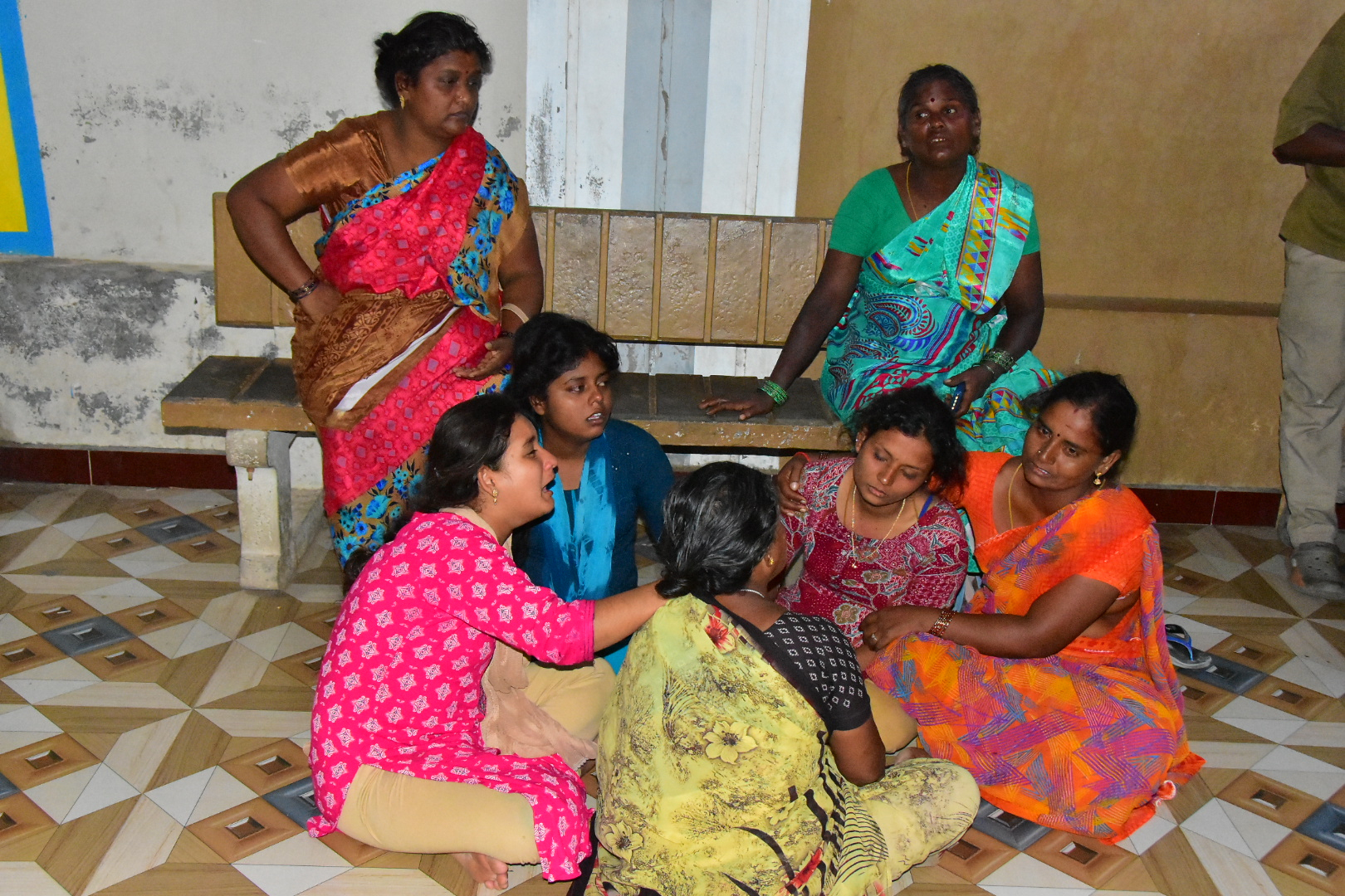 Relatives of people who were killed in a stampede during a rally for a popular Indian actor and politician, mourn outside a hospital, in Karur, in the southern state of Tamil Nadu, Saturday, Sept. 27, 2025. (AP Photo)